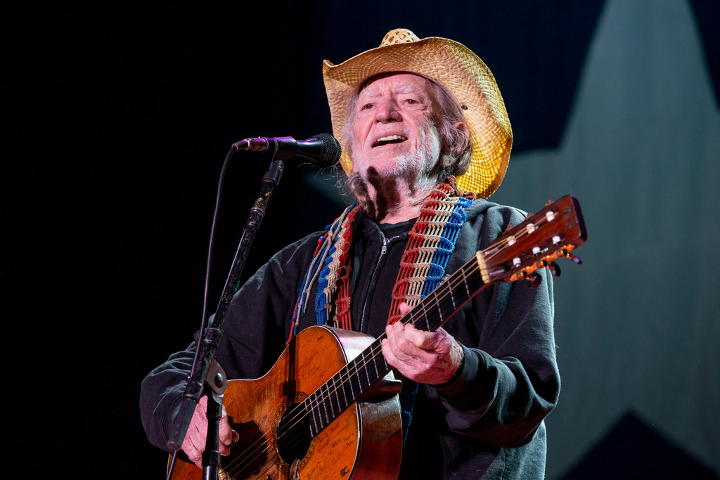 Willie Nelson inhales the love at 90th birthday concert