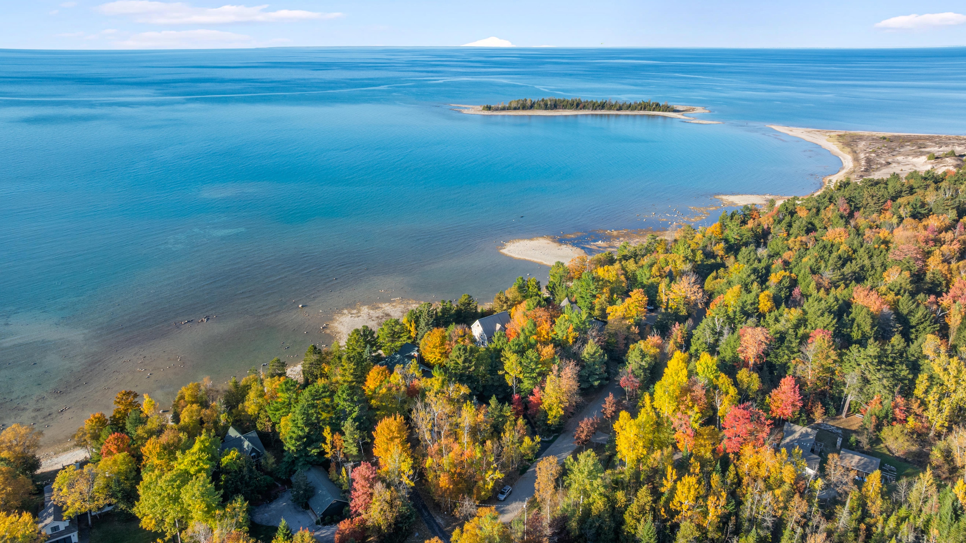 Aerial photographs of 4093 Lake Shore Drive in Charlevoix, this gem is listed at $2,099,900 through Berkshire Hathaway HomeServices Michigan Real Estate – Traverse City and The Crane Group with associate broker Johnny Crane and his brother, co-listing agent Matt Crane.