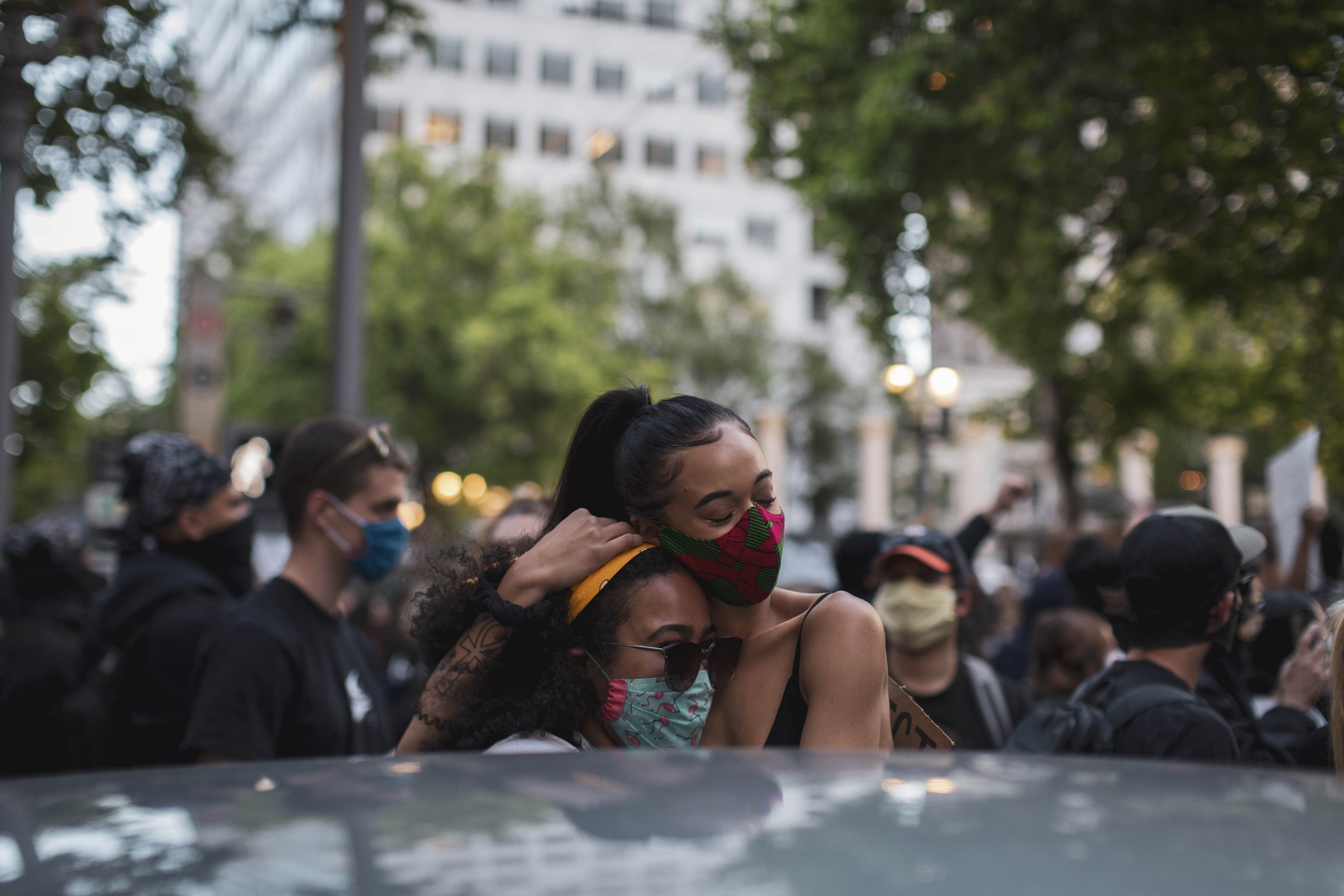Two women embrace at Pioneer Square on Tuesday evening, June 3. Protests continued for a sixth night in Portland, demonstrating against the death of George Floyd, a black man killed by police in Minneapolis. Brooke Herbert / Staff