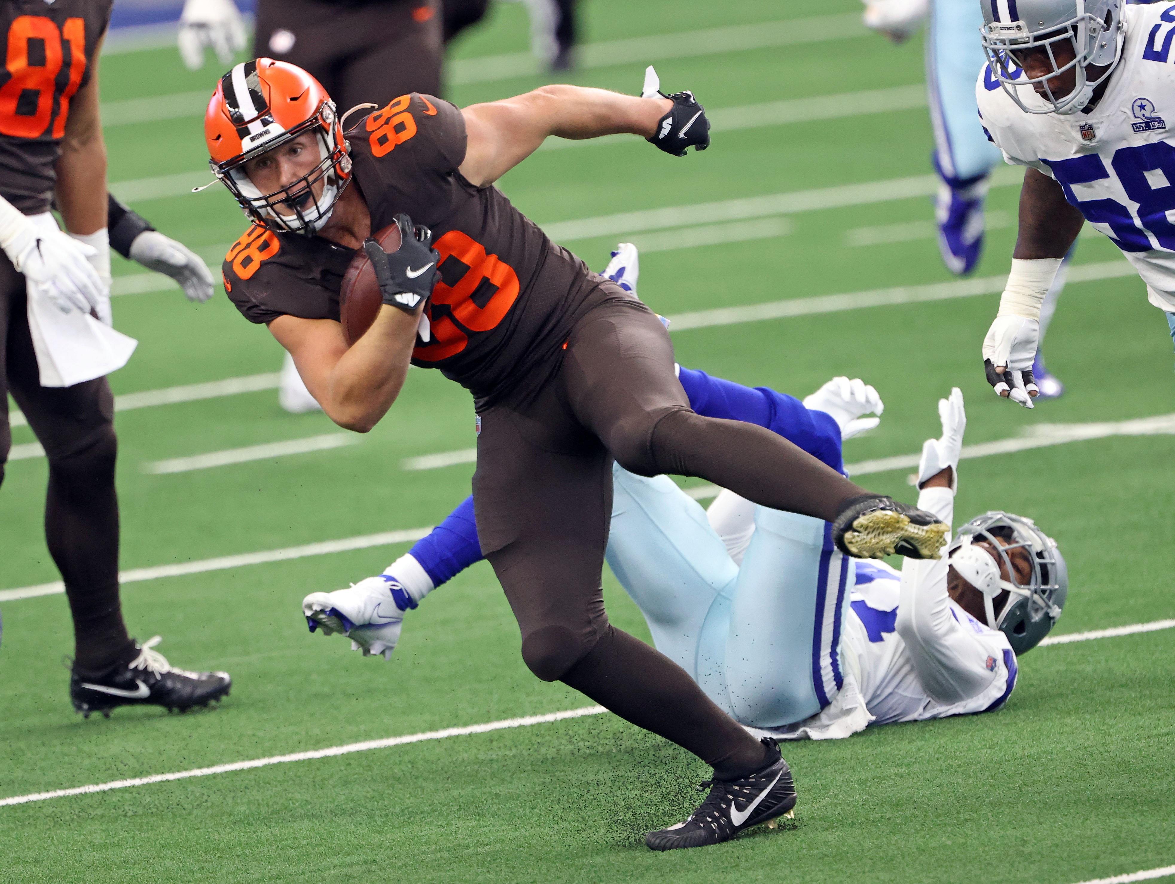 Cleveland Browns tight end Harrison Bryant (88) fumbles the football while  being tackled by Las …