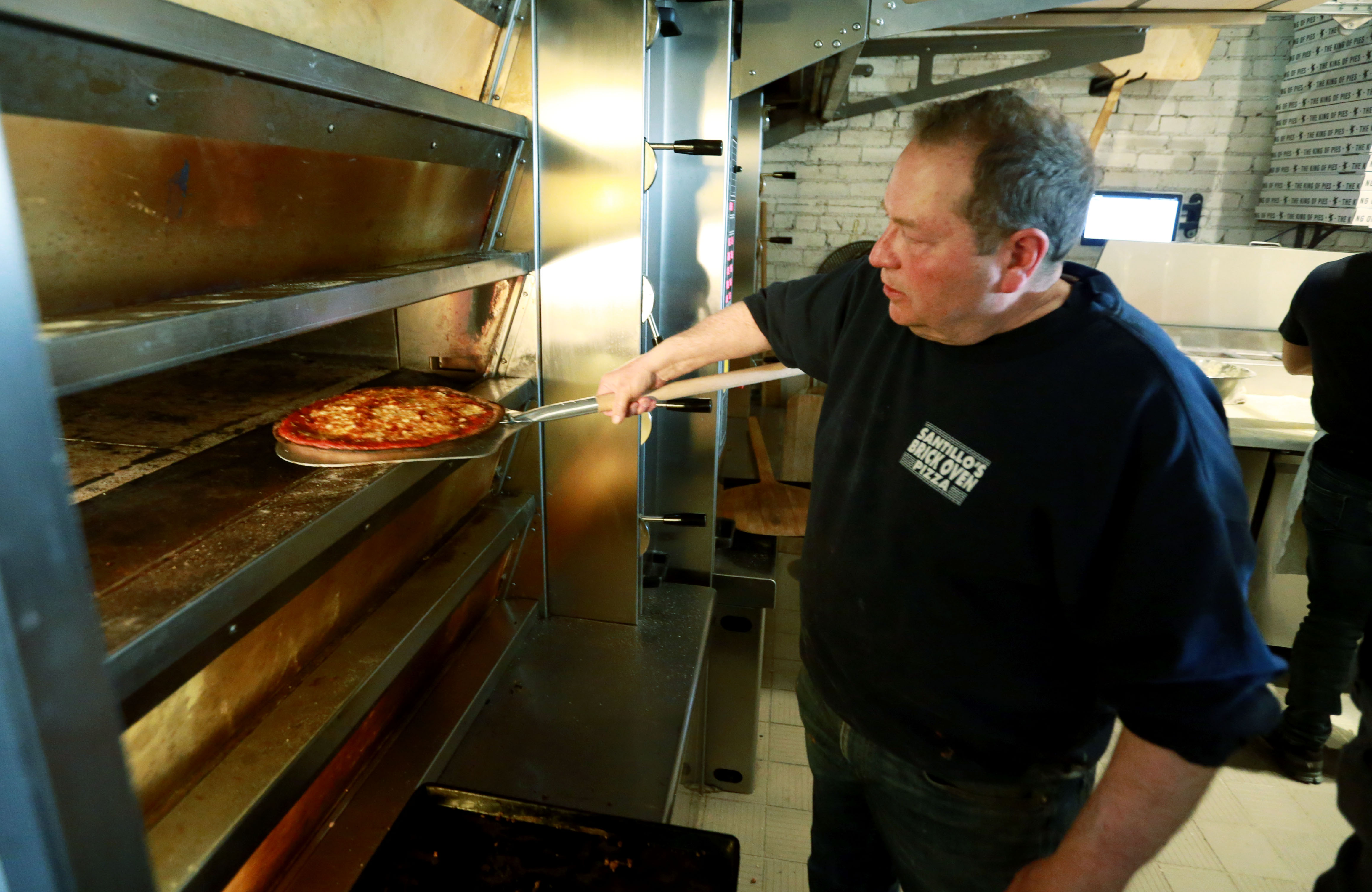 Pizza maker Al Santillo is making pizza at Coniglio’s as his place is ...