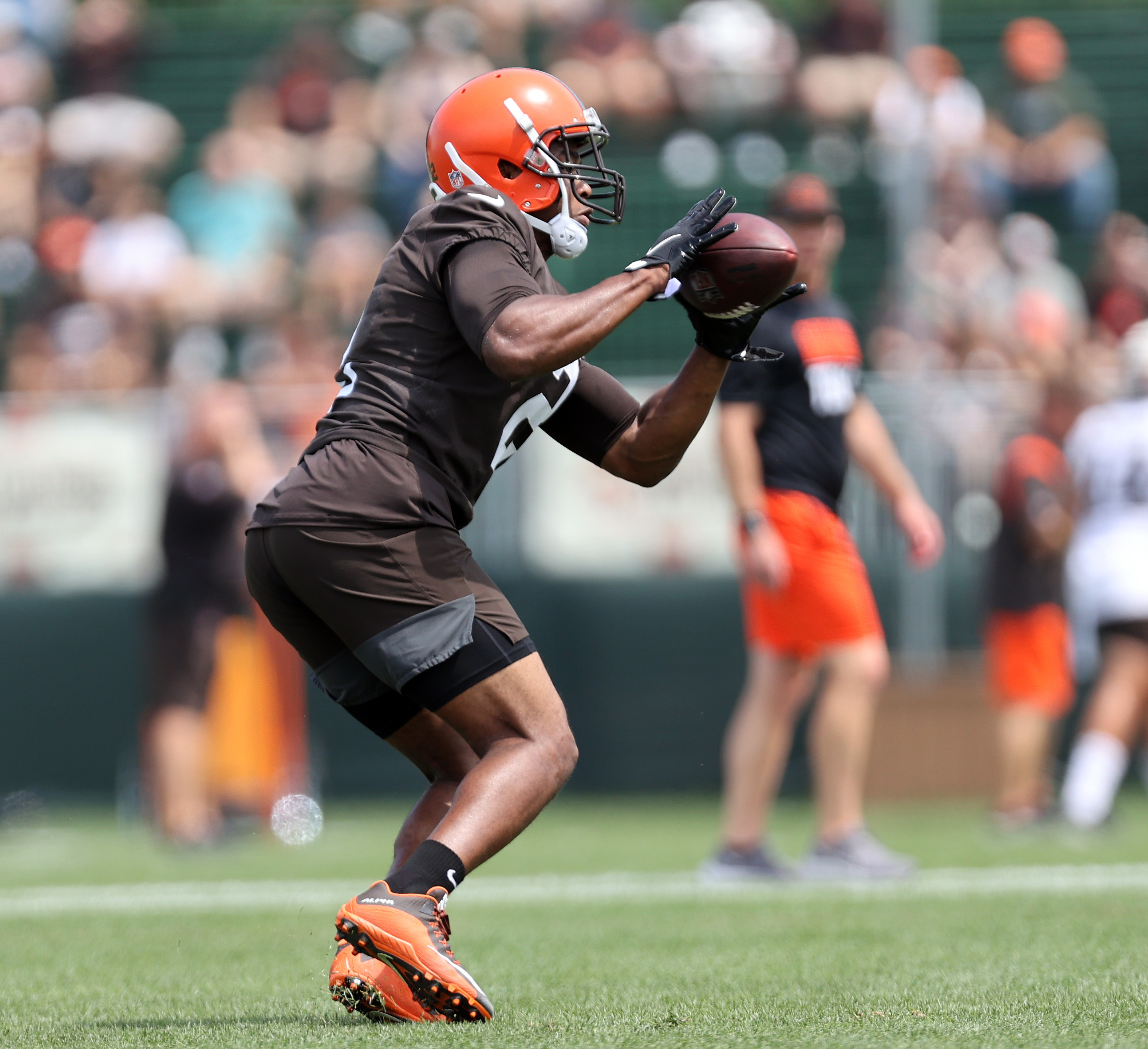 Cleveland Browns tackle James Hudson III warms-up drill during an