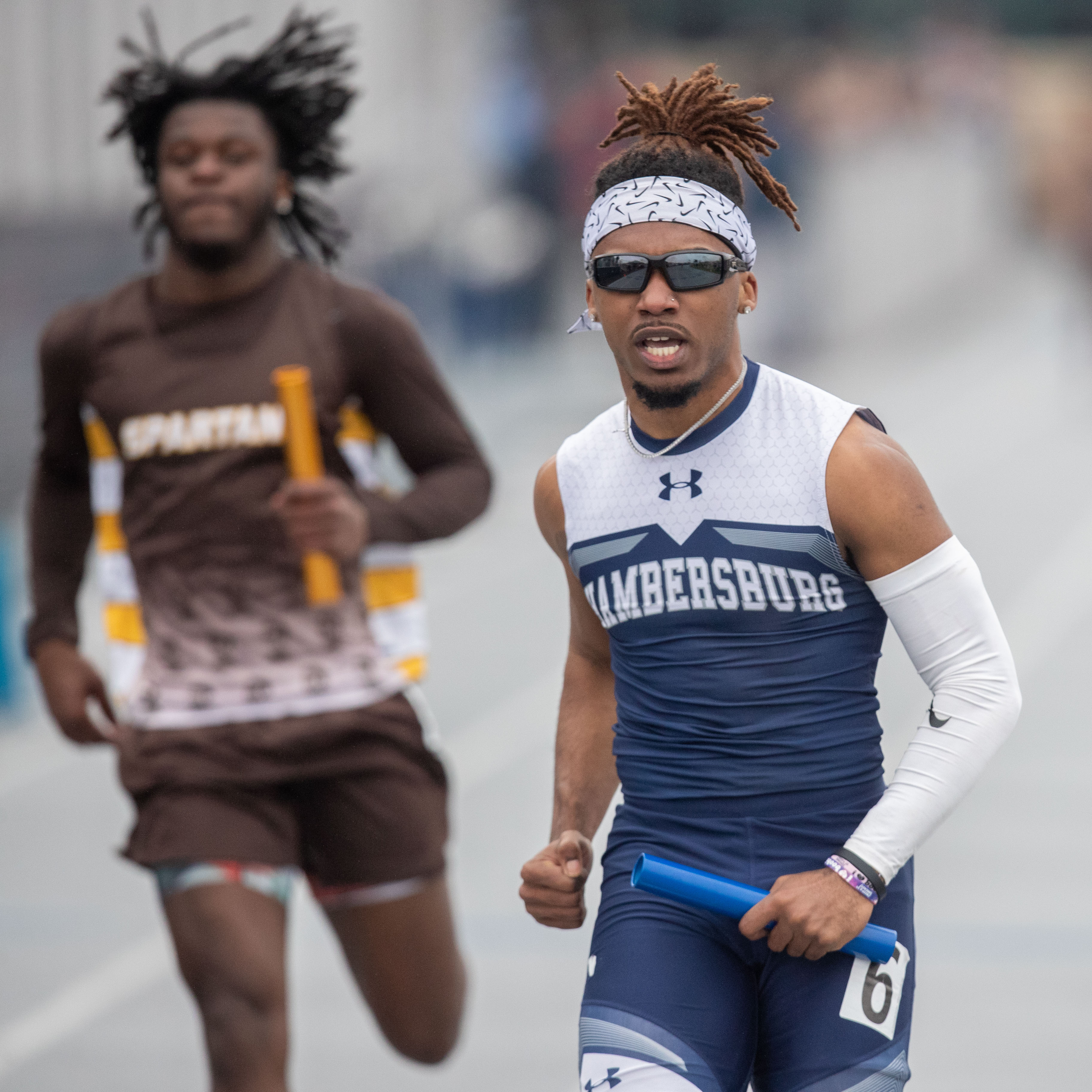 Chambersburg’s Antonio Harrison, right, anchors the winning 4 x 100 meter relay win at the 2023 Tim Cook Memorial Invitational track & field meet at Chambersburg, Pa., Mar. 25, 2023.Mark Pynes | pennlive.com