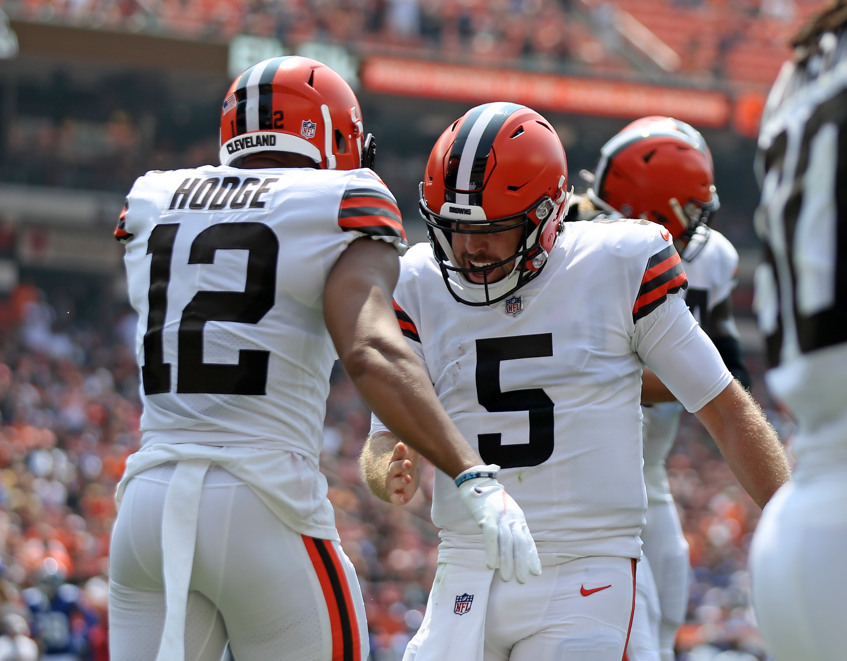 Cleveland Browns quarterback Kyle Lauletta (17) rushes against New York  Giants defensive tackle David Moa (96)