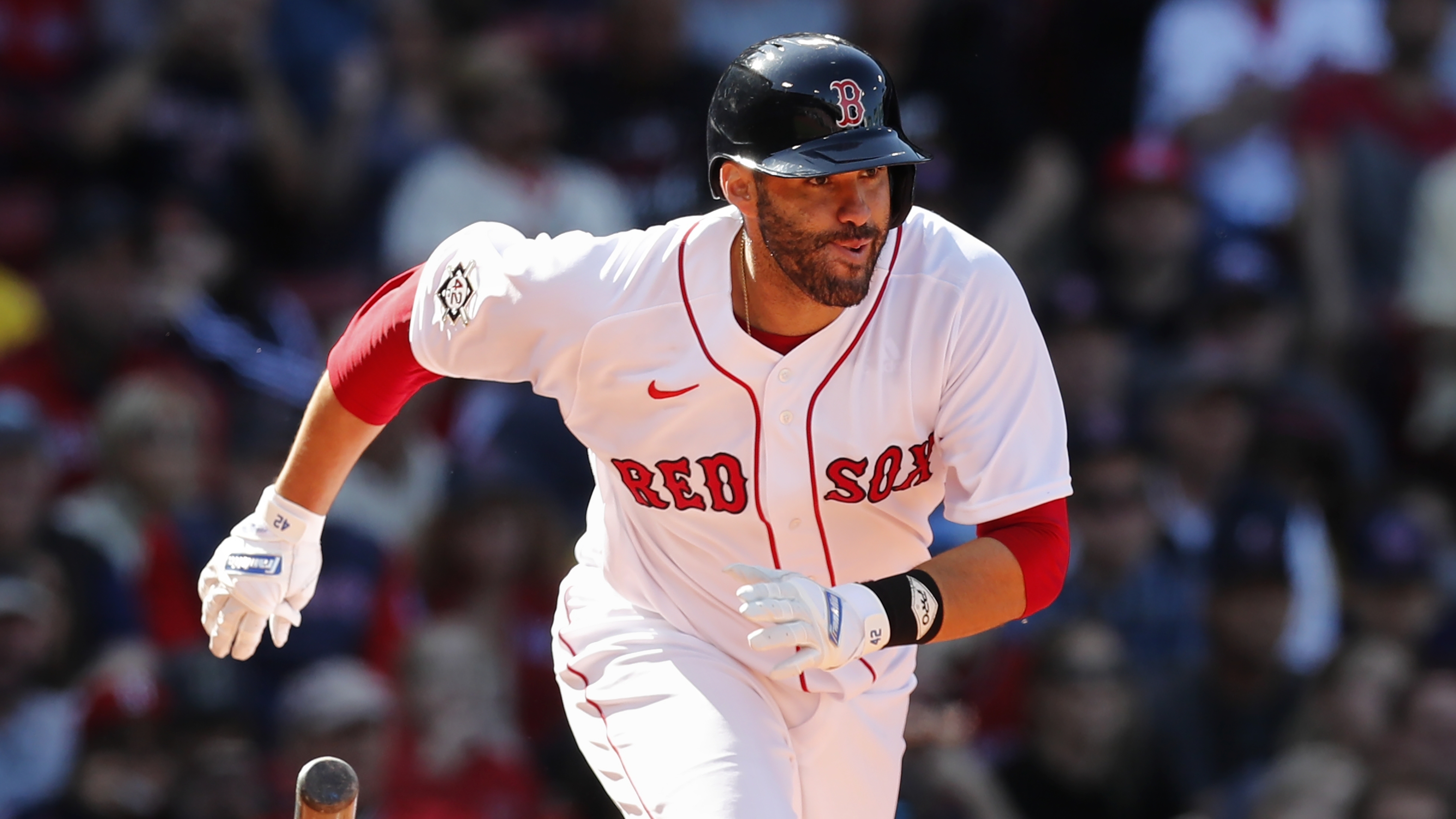 J.D. Martinez of the Boston Red Sox is pushed in a laundry cart