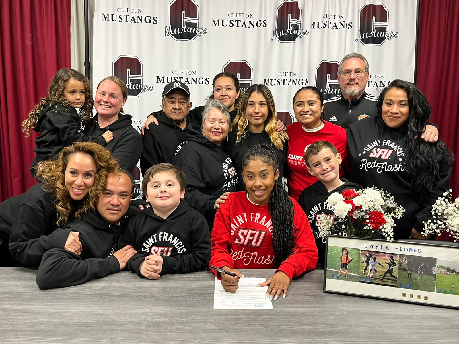 Clifton's Layla Flores signs her NLI to Saint Francis alongside family, friends, and her coach.