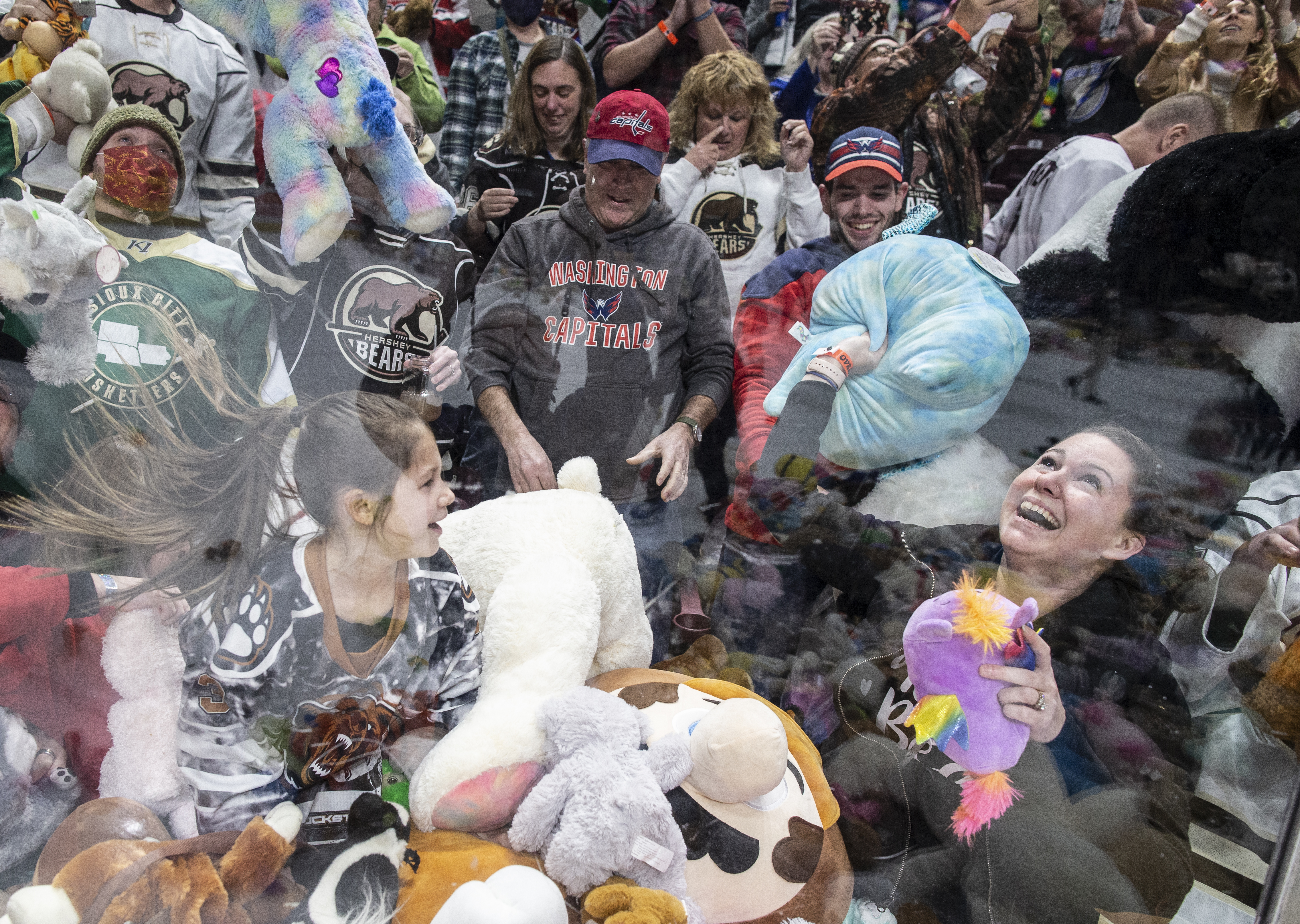 Fans launch 2,115 teddy bears, stuffed toys onto ice at Lancers game for a  good cause