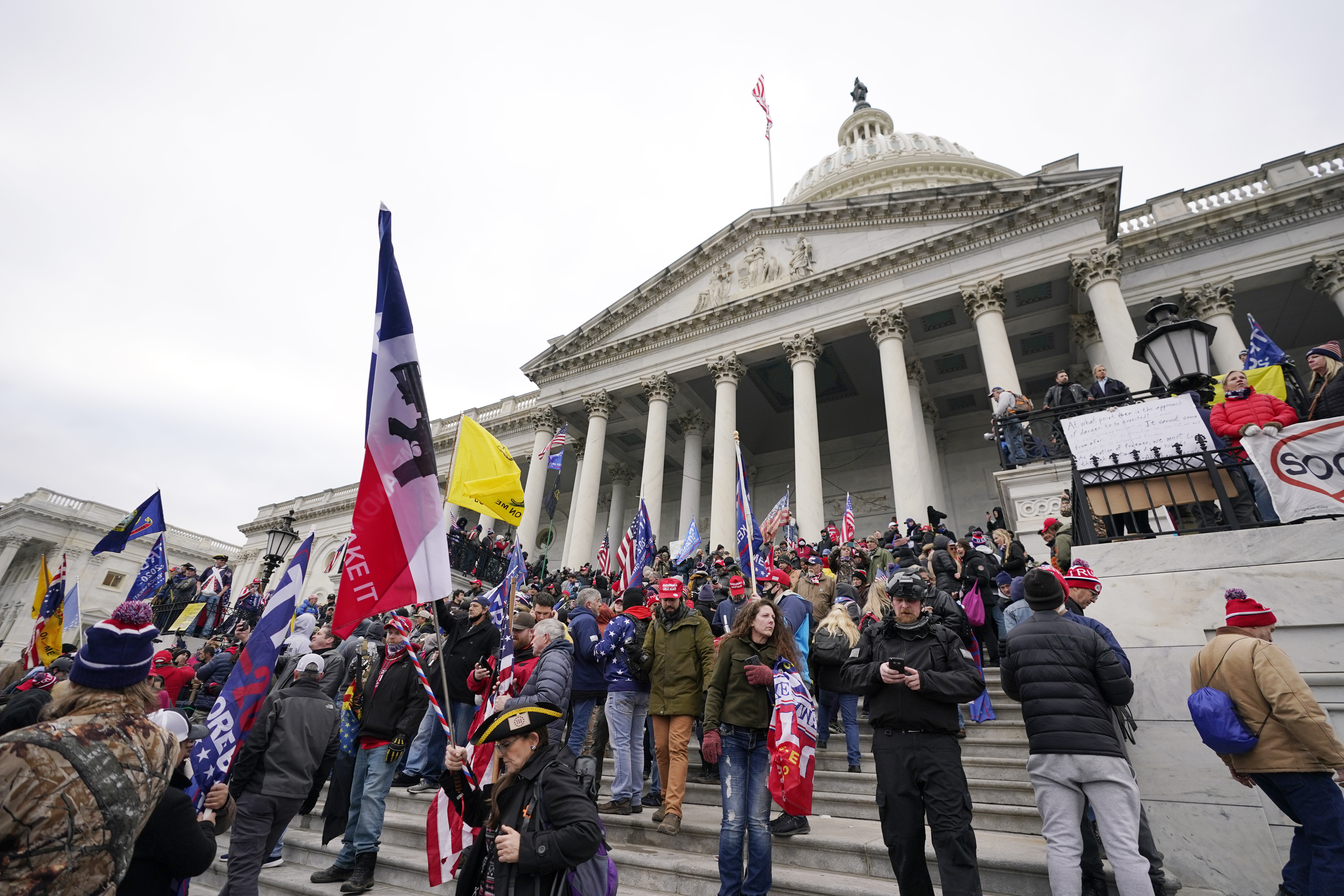 Face-painted man in horned fur cap at Capitol riot supports Trump