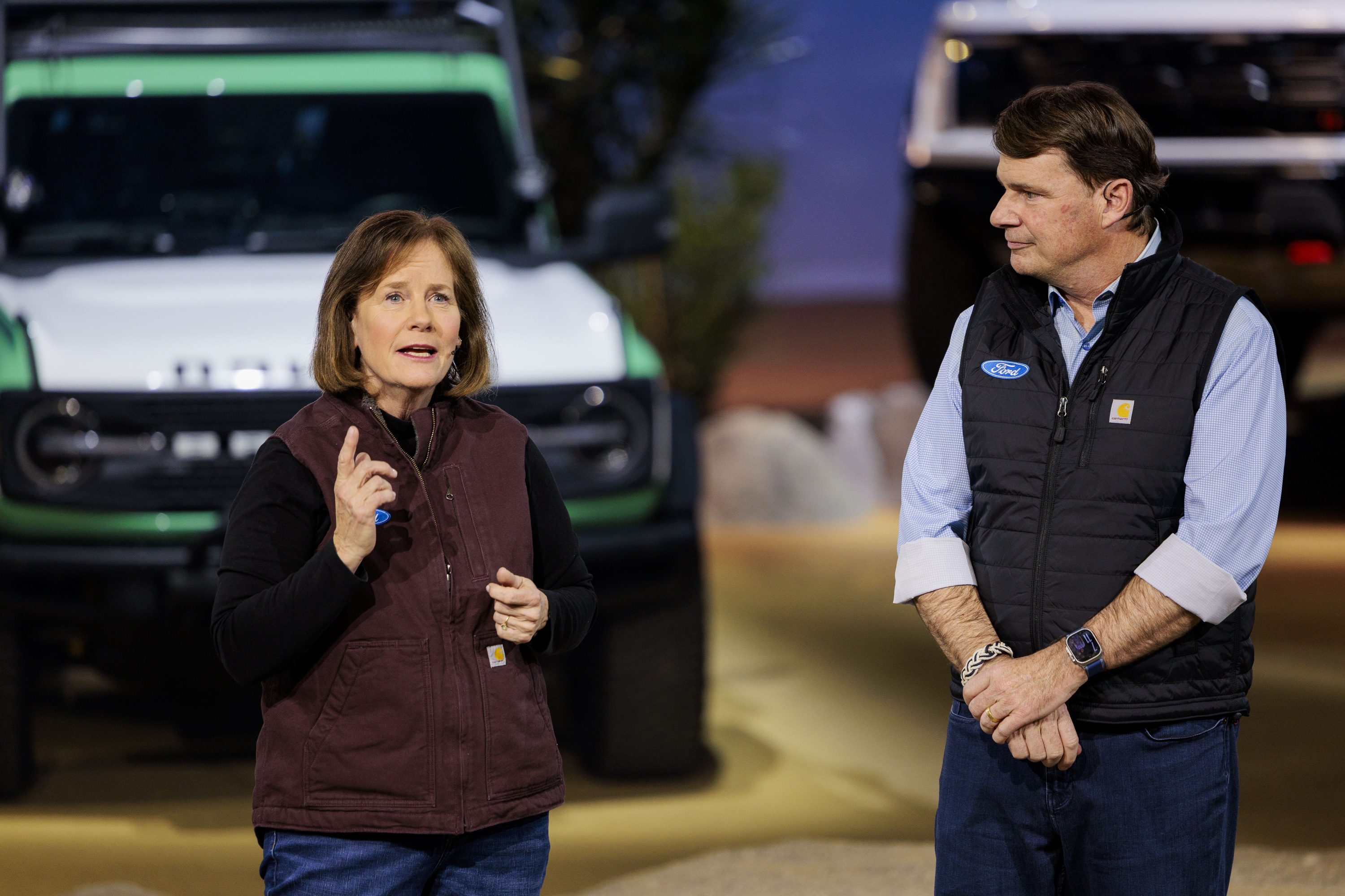 Ford CEO Jim Farley, right, and Linda Hubbard, CEO of Carhartt, speak during a Ford Motor Company event ahead of the Detroit Auto Show at Huntinton Place in Detroit on Tuesday, Jan. 13 2026.