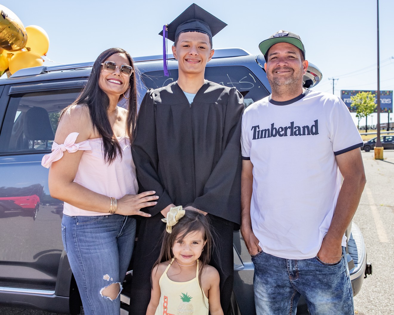 Ricardo A. Nieves, mother Ziamara, father Ricardo and sister Adriana pose for a photo at the Veritas Prep Charter School 8th grade 2020 DRIVE-In Graduation held in the parking lot of the Eastfield Mall. (Danny Nason Photo)