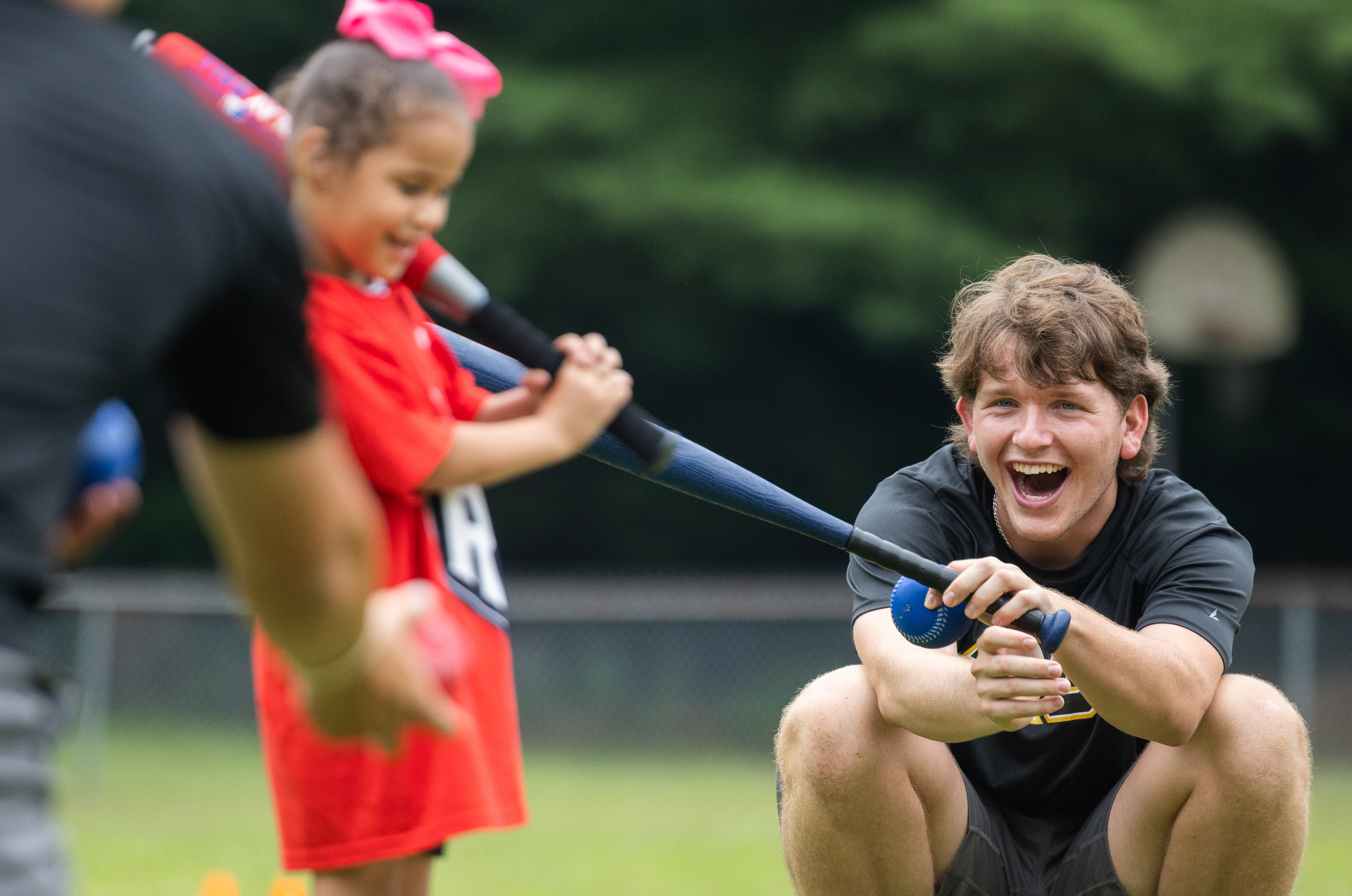 Square One children participate in a baseball & softball clinic