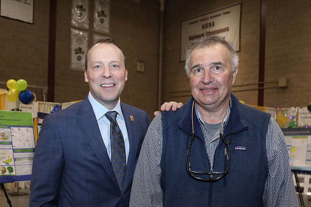 L to R- STCC President Dr. John Cook and Dave Bloniarz from ReGreen Springfield at the Sustainathon event taking place in the gym in building 2 at Springfield Technical Community College on April 11th. (Ed Cohen Photo)