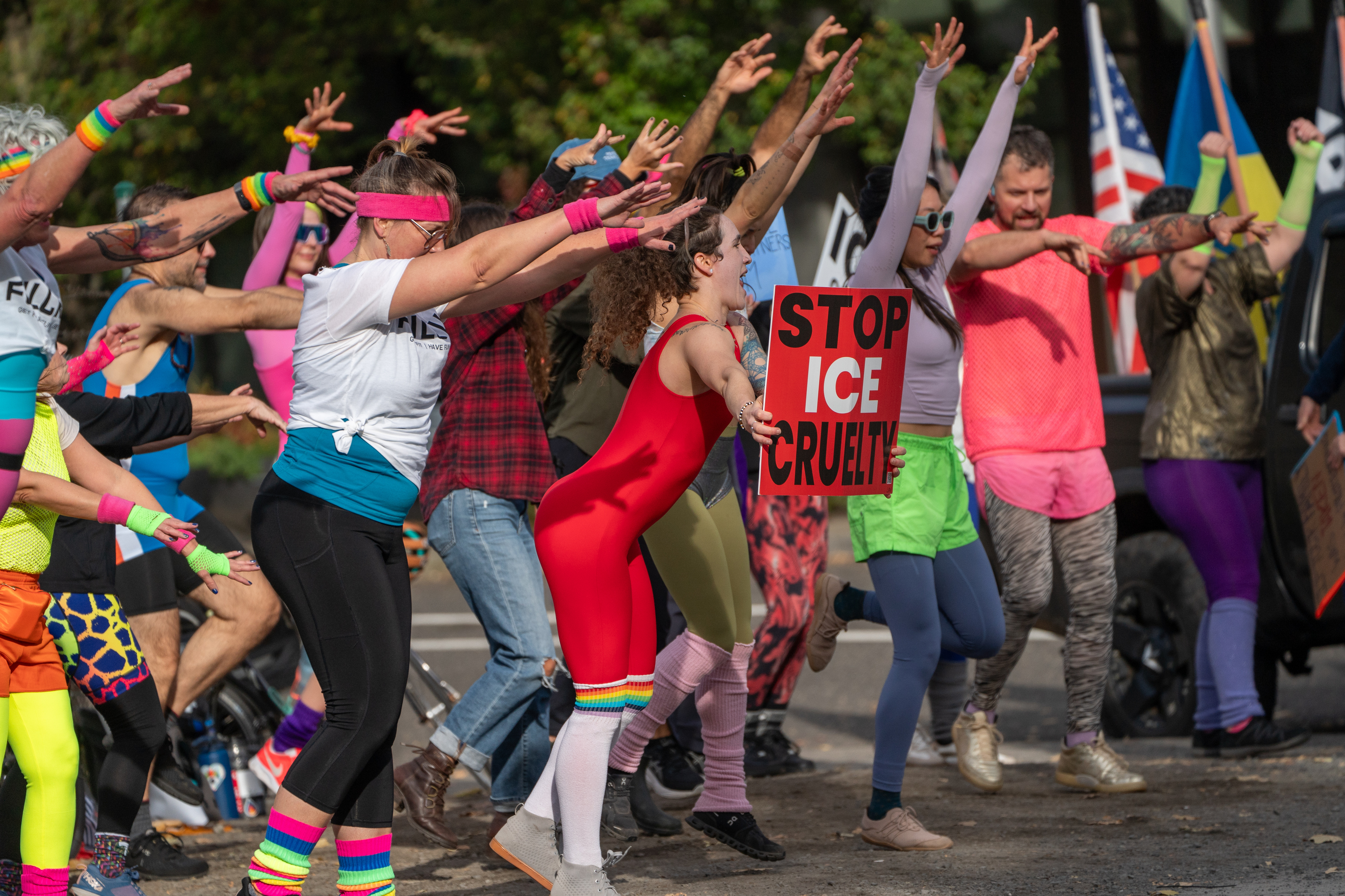 Participants in Fulcrum Fitness’s “Sweatin’ Out the Fascists” held an ’80s-aerobics peaceful protest outside the U.S. Immigration and Customs Enforcement (ICE) facility in South Portland on Sunday, Nov. 9, 2025, collecting donations for the Oregon Food Bank.