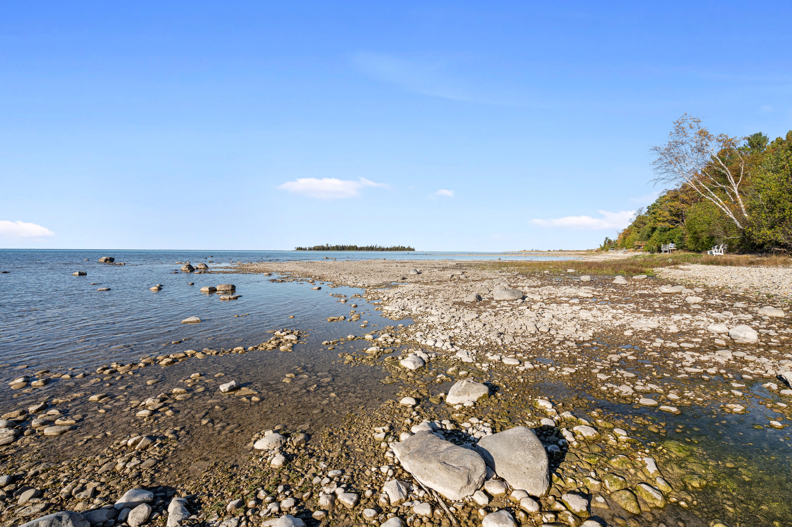 Exterior photographs of 4093 Lake Shore Drive in Charlevoix, this gem is listed at $2,099,900 through Berkshire Hathaway HomeServices Michigan Real Estate – Traverse City and The Crane Group with associate broker Johnny Crane and his brother, co-listing agent Matt Crane.