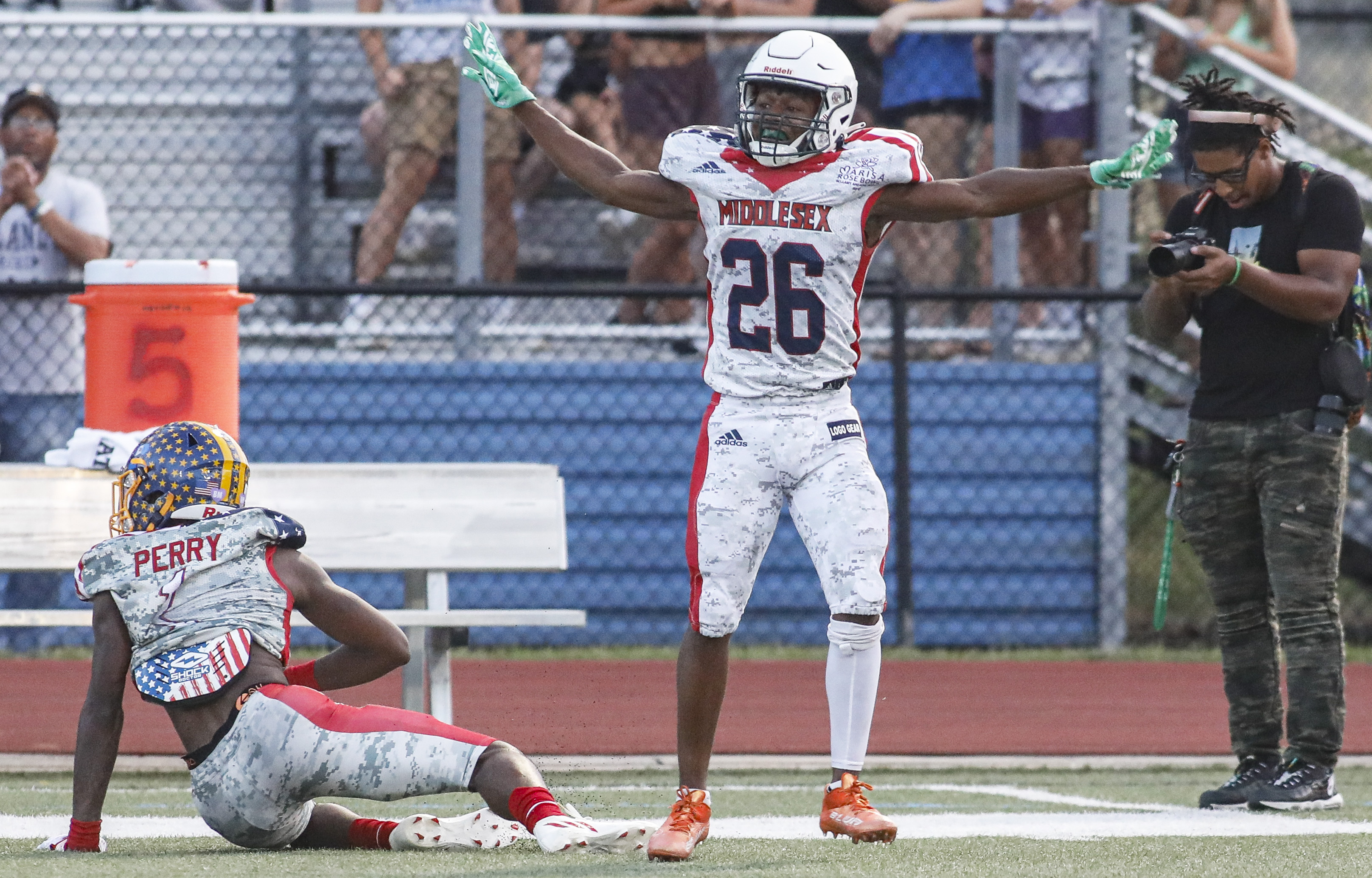 Football players jell together for the Marisa Rose Bowl