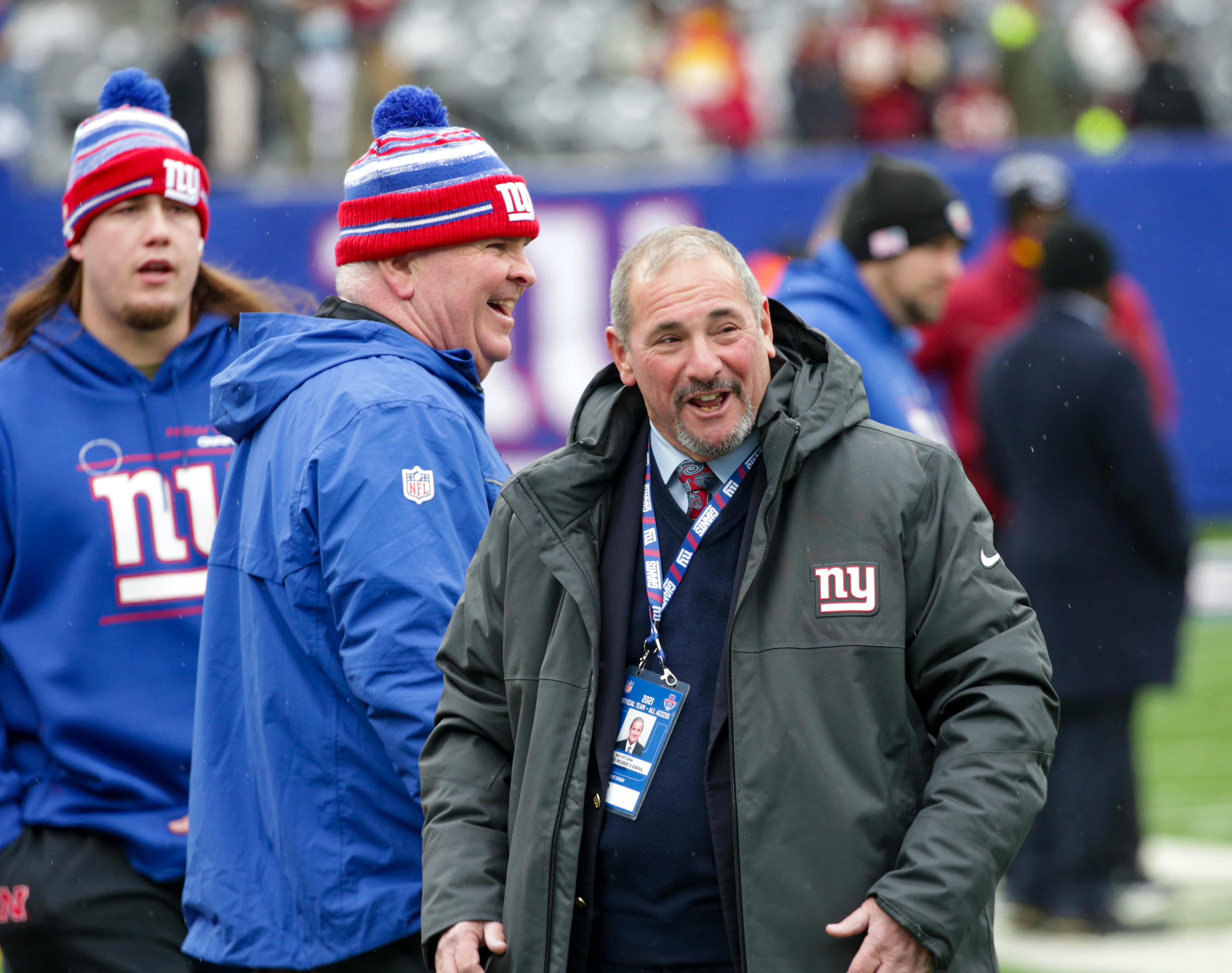 New York Giants general manager Dave Gettleman has a laugh with Giants security man Mike Murphy during pregame warmups as the Giants prepare to host the Washington Football Team on Sunday, Jan. 9, 2022 in East Rutherford, N.J.