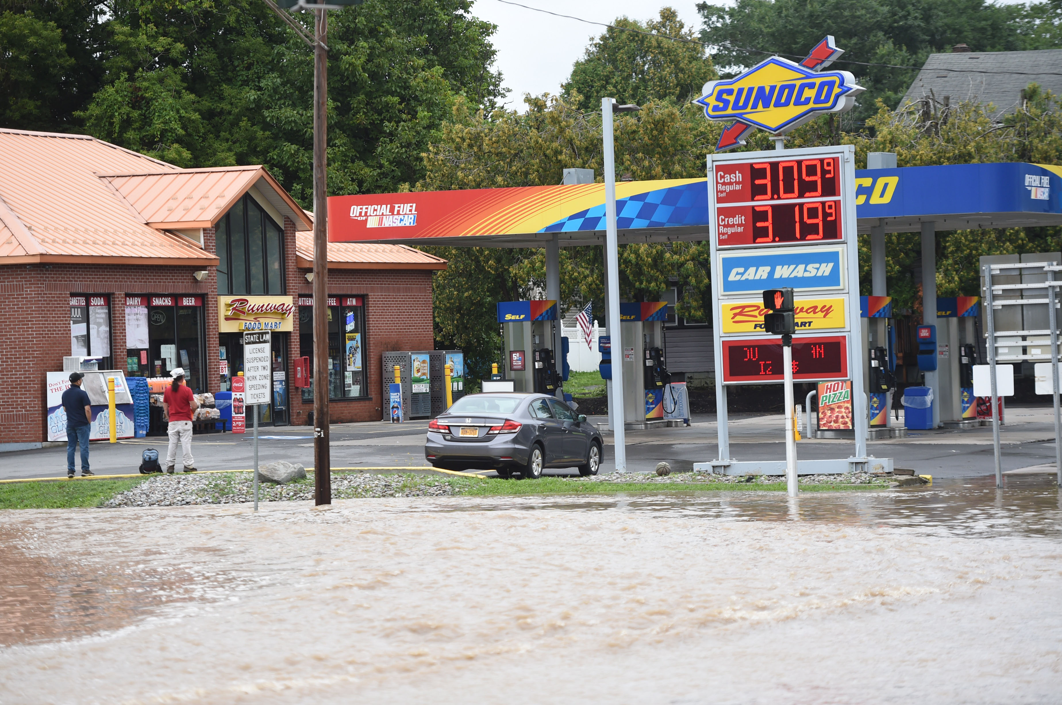The corner of Newport Road and Genesee Street in the village of Camillus is flooded August 19, 2021 after heavy rains continued in Central New York. A lot of flooding occurred along Ninemile Creek in Camillus and Marcellus. Dennis Nett | dnett@syracuse.com