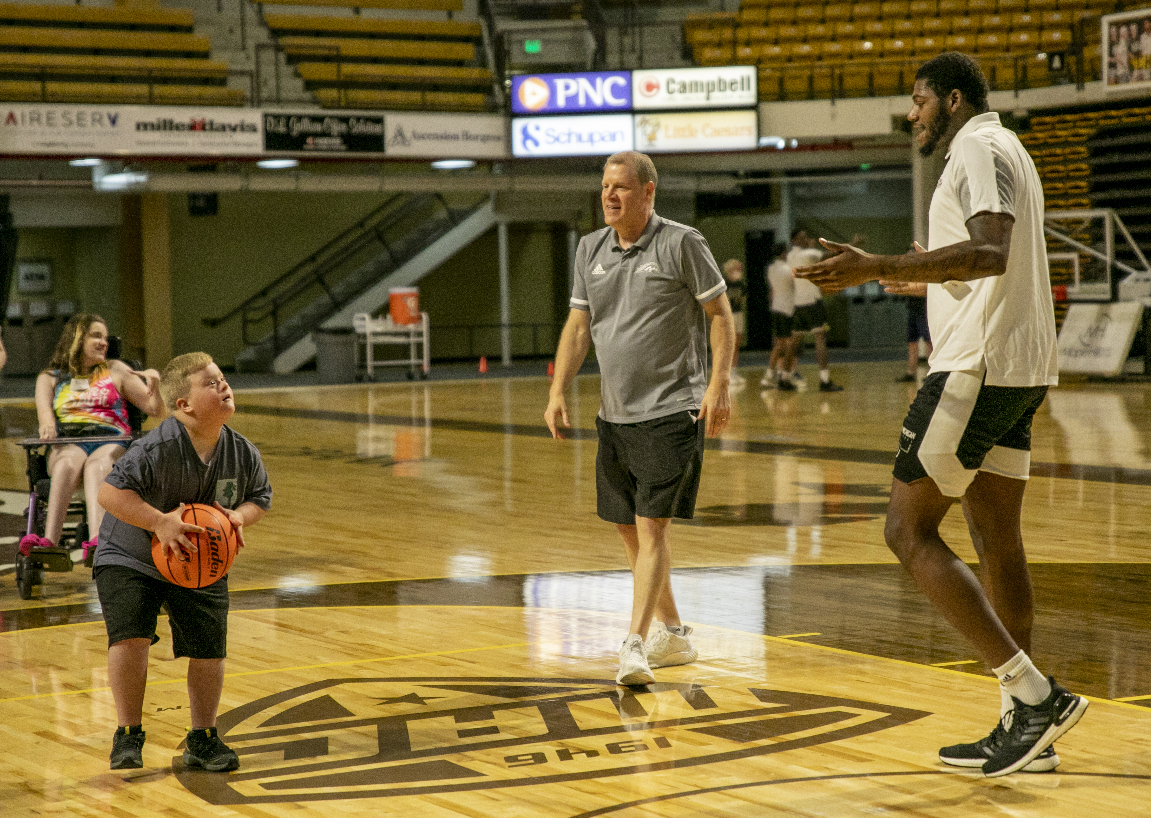 The Beautiful Lives Project collaborates with Western Michigan University’s basketball team to give disabled kids and adults a chance to play basketball with members of WMU's men's basketball team and coaching staff at WMU’s University Arena in Kalamazoo, Michigan on Wednesday, June 15, 2022. (Gabi Broekema | MLive.com)