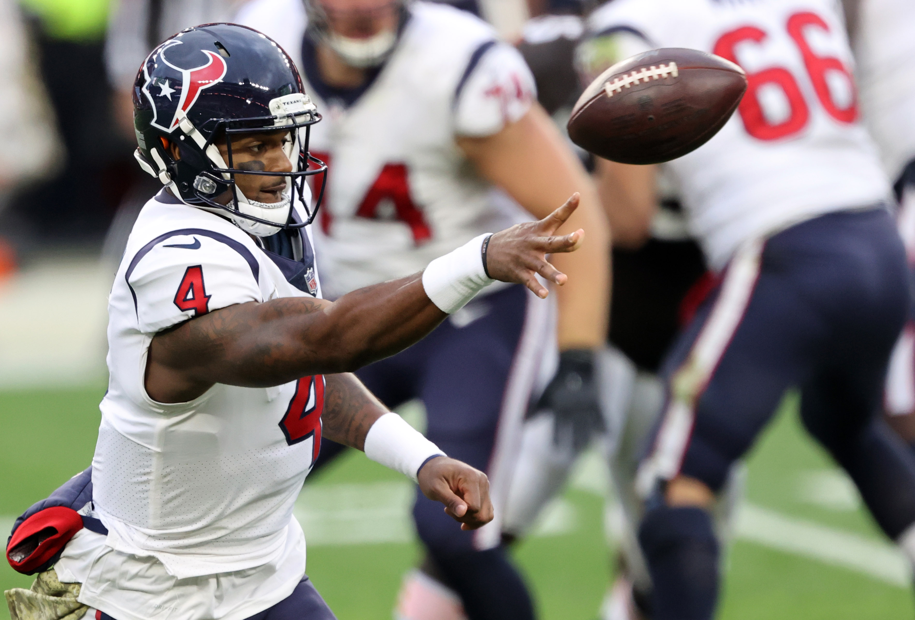 Cleveland Browns DESHAUN WATSON (4) escapes Houston Texans defenders during  the game between the Cleveland Browns and the Houston Texans in Houston,  Texas at NRG Stadium on December 4, 2022. The Cleveland