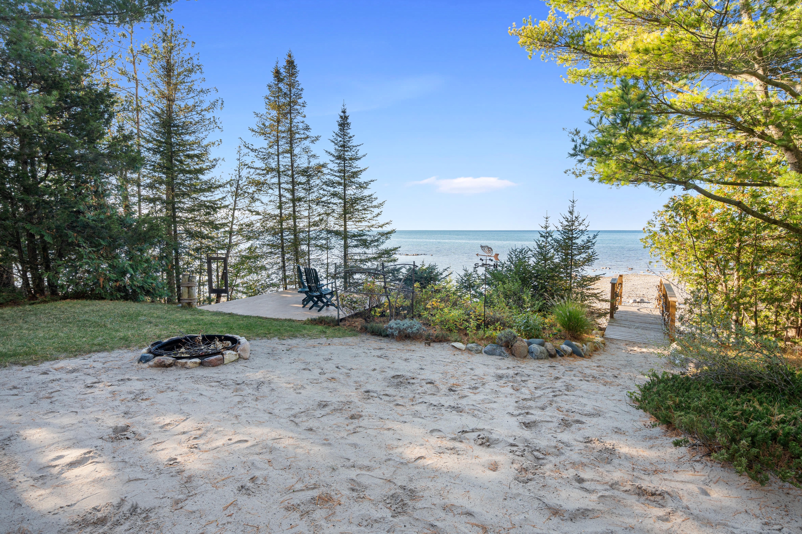 Exterior photographs of 4093 Lake Shore Drive in Charlevoix, this gem is listed at $2,099,900 through Berkshire Hathaway HomeServices Michigan Real Estate – Traverse City and The Crane Group with associate broker Johnny Crane and his brother, co-listing agent Matt Crane.