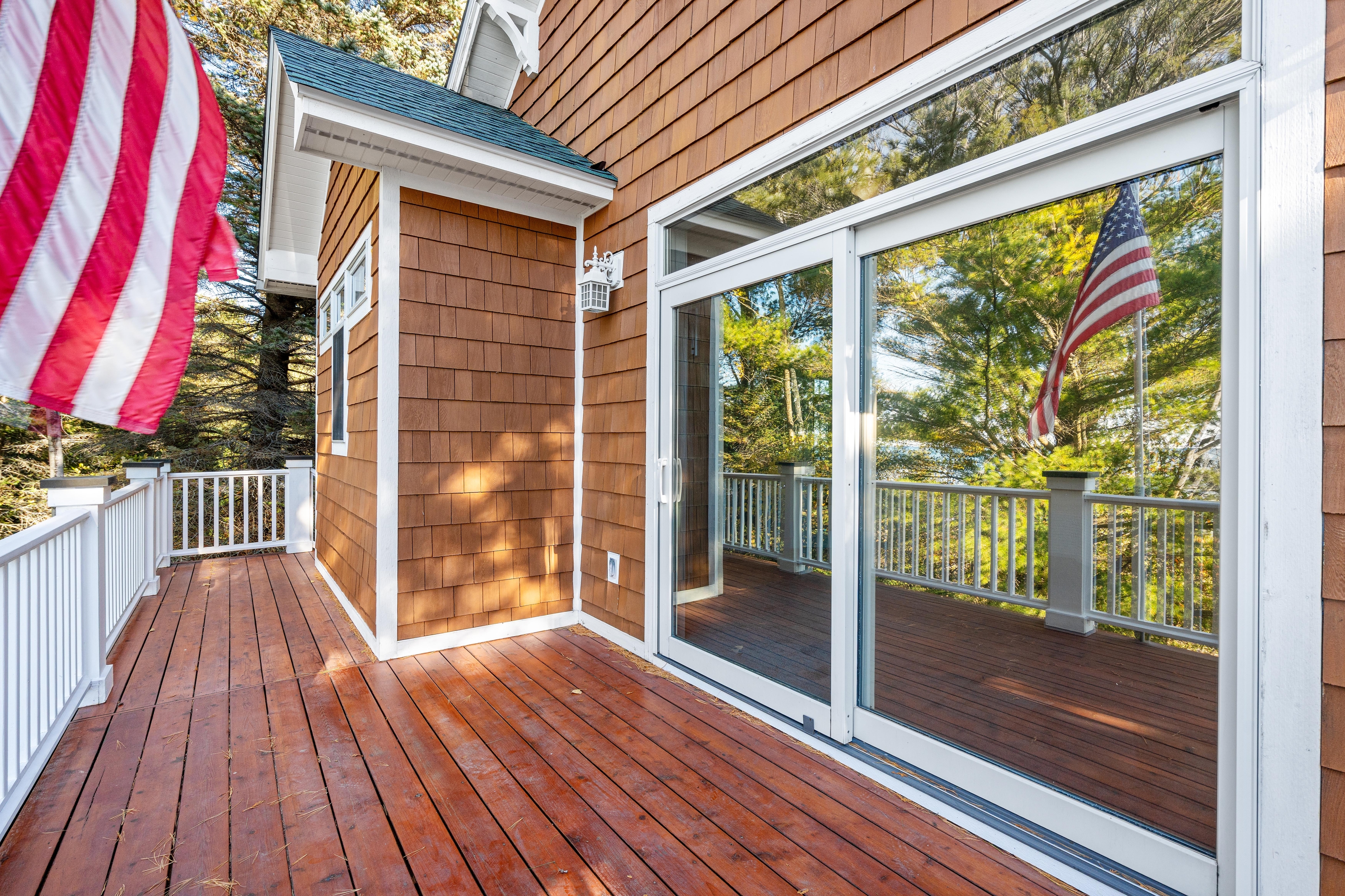 Exterior photographs of 4093 Lake Shore Drive in Charlevoix, this gem is listed at $2,099,900 through Berkshire Hathaway HomeServices Michigan Real Estate – Traverse City and The Crane Group with associate broker Johnny Crane and his brother, co-listing agent Matt Crane.