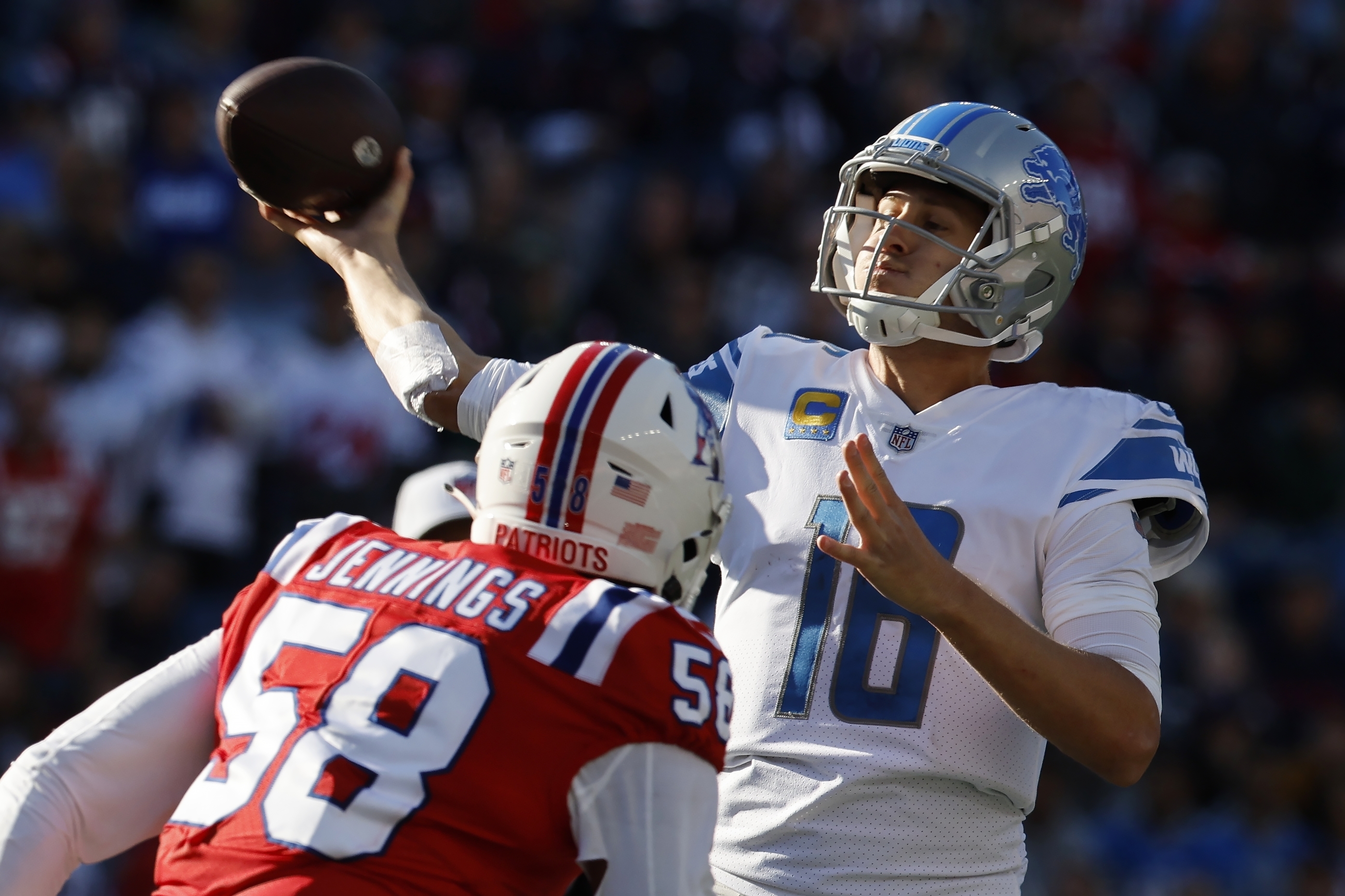 The New England Patriots, wearing their throwback uniforms, and the Detroit  Lions line up for the snap at the line of scrimmage during an NFL football  game at Gillette Stadium, Sunday, Oct.