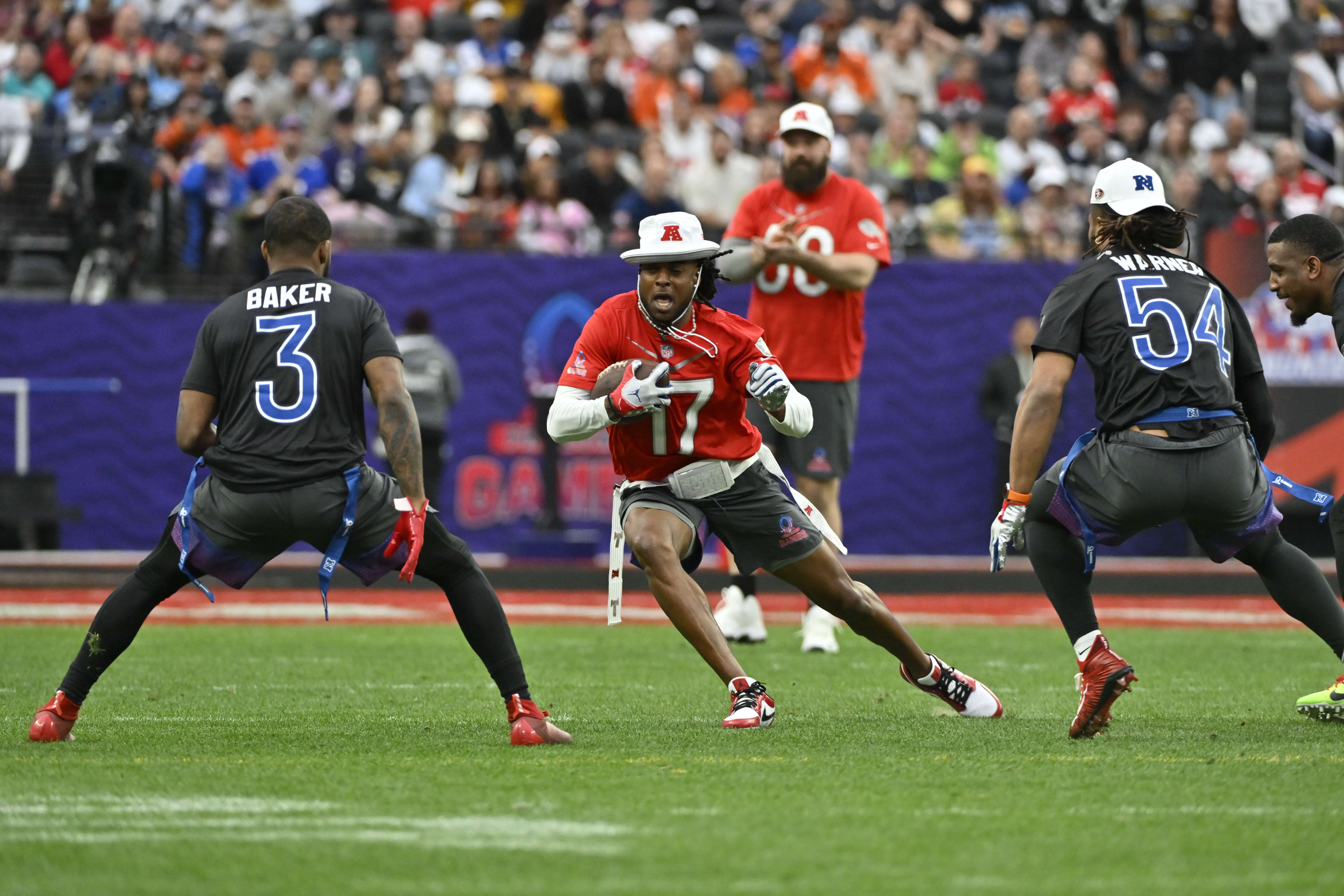 NFC tight end George Kittle (85) of the San Francisco 49ers celebrates a  touchdown with NFC wide receiver Justin Jefferson of the Minnesota Vikings  during the flag football event at the NFL