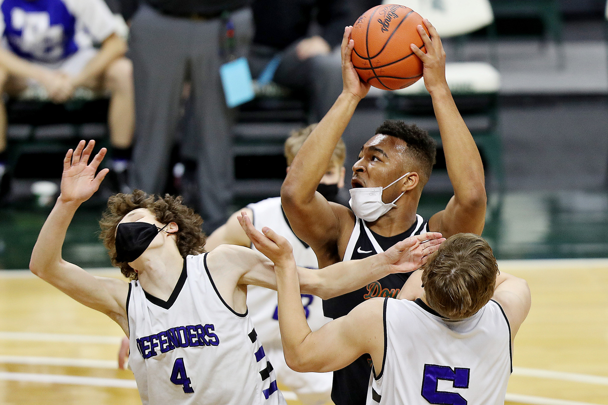 Photos of Detroit Douglass basketball player Pierre Brooks II