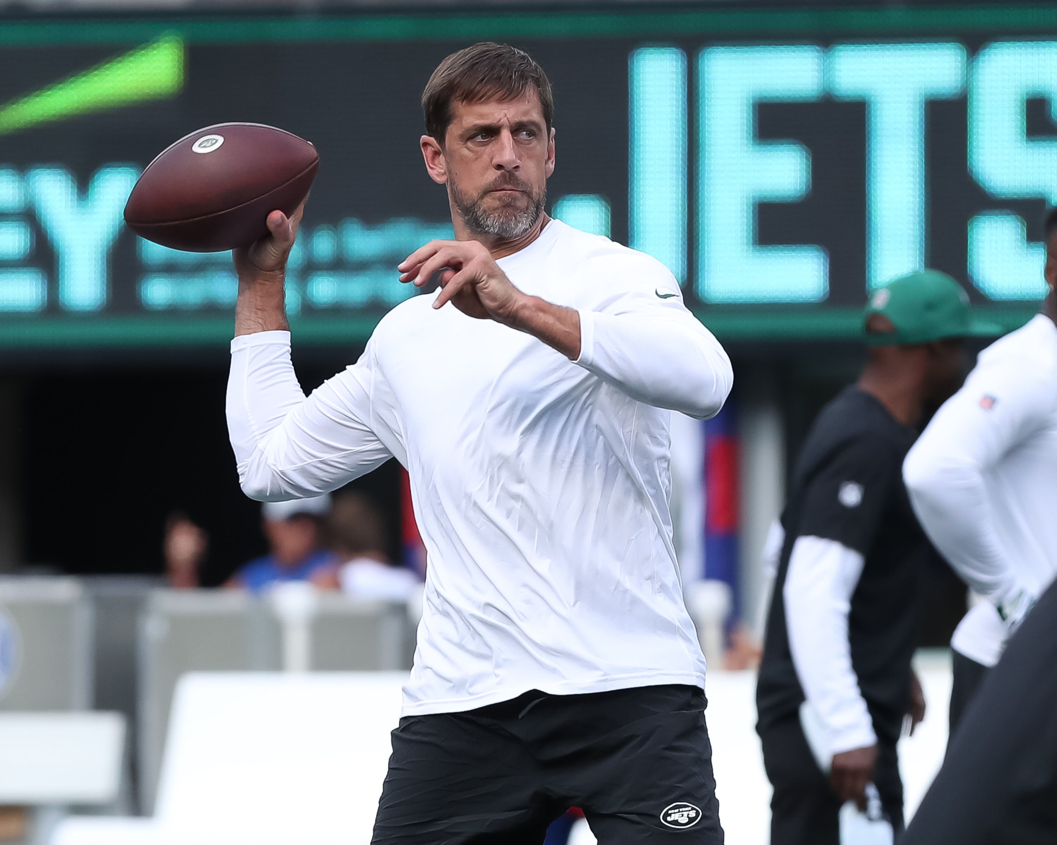 New York Jets offensive tackle Mekhi Becton (77) hugs quarterback Aaron  Rodgers (8) during an NFL football game against the New York Giants,  Saturday, Aug. 26, 2023 in East Rutherford, N.J. Jets