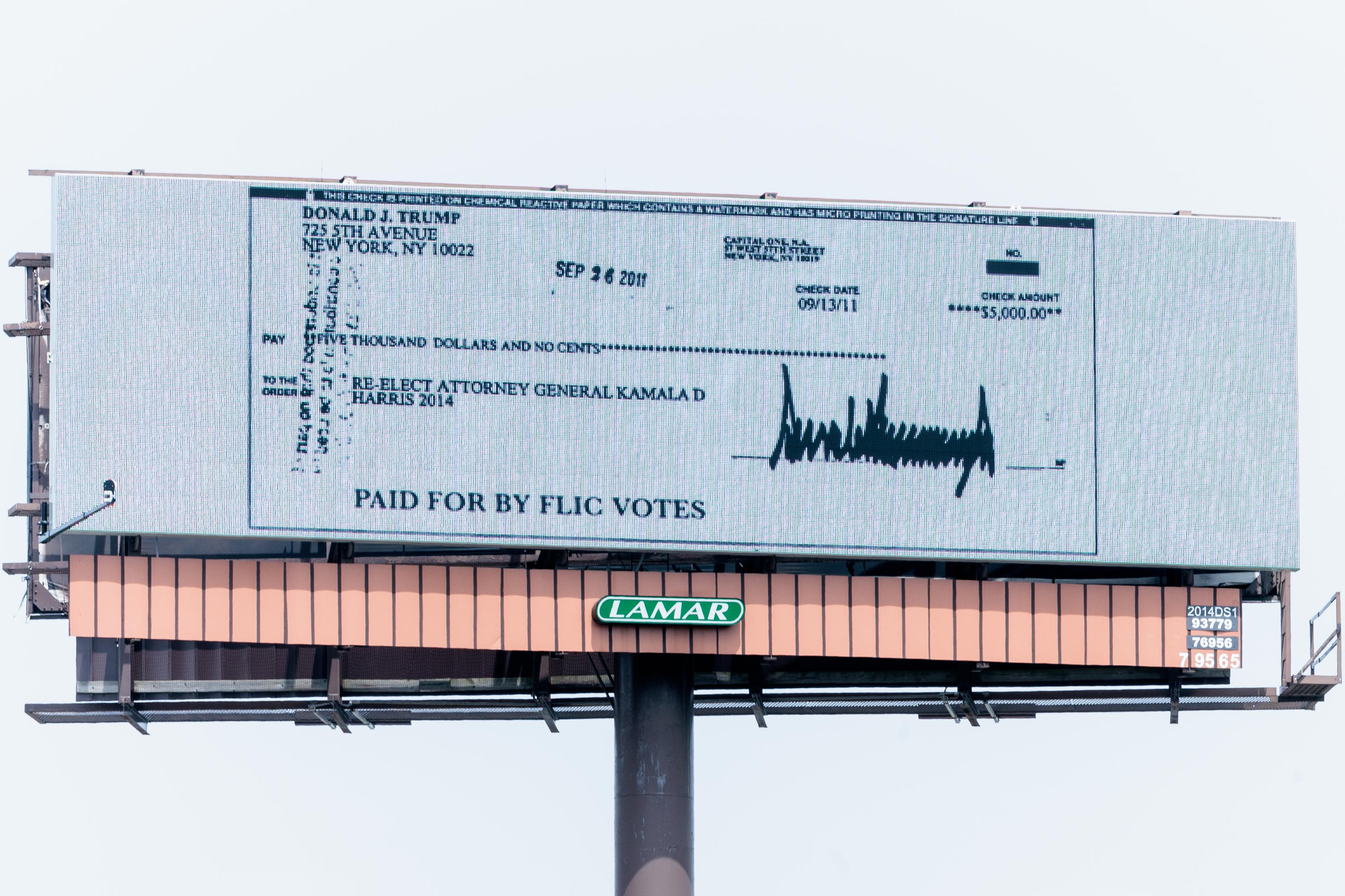 I75 billboard near Detroit displays 2011 Trump donation check written