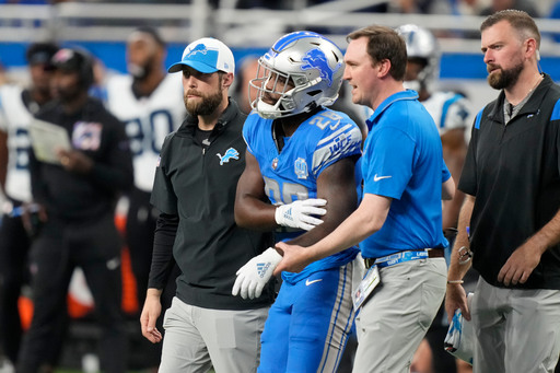 Lions' Jared Goff shares celebratory sideline kiss with Christen