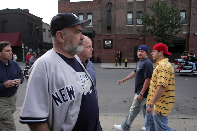 In enemy territory: Yankee fan John Lavelle gets beer bath from Red Sox fan  in Boston in 2004 