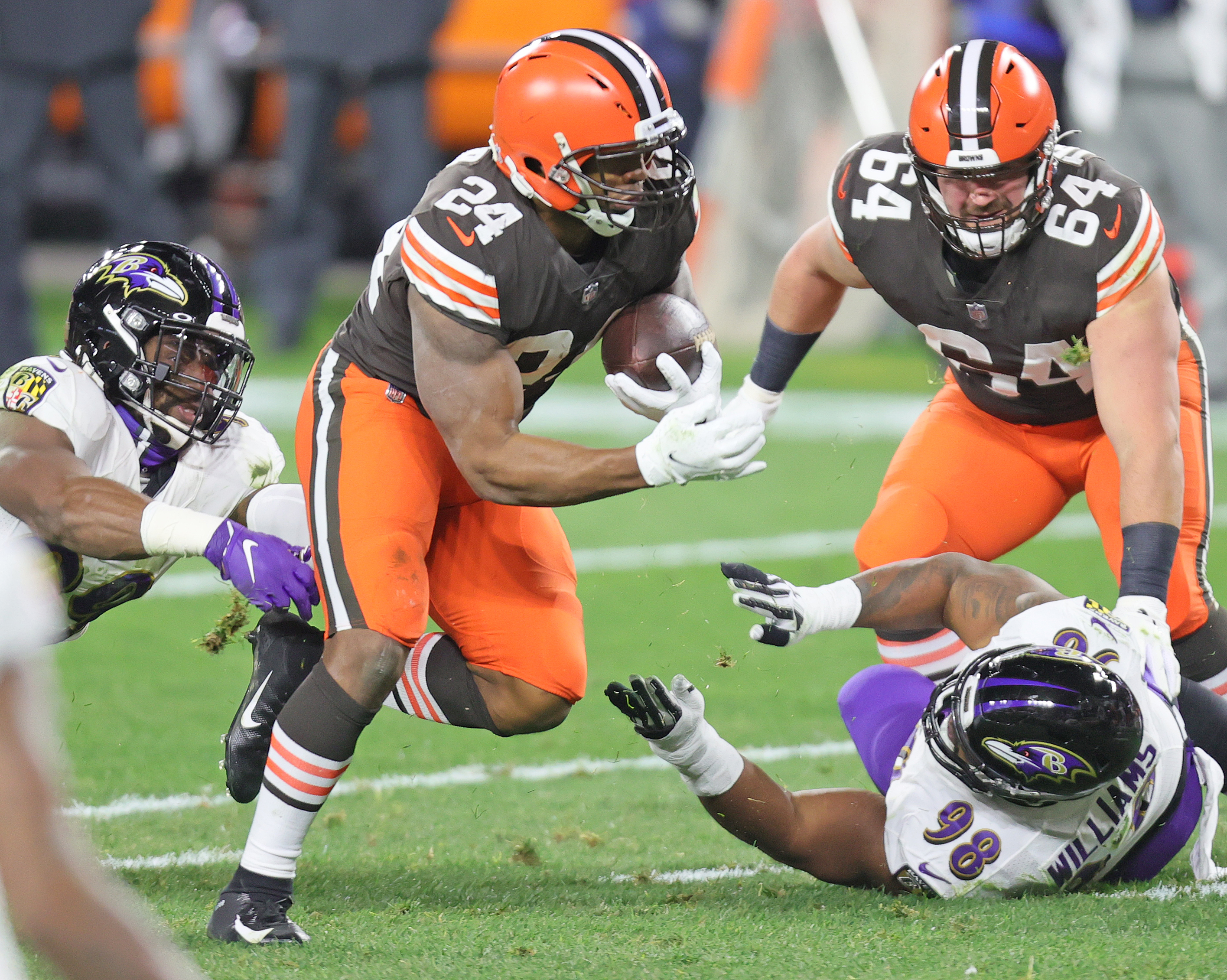 Baltimore Ravens running back J.K. Dobbins (27) takes a handoff from  quarterback Lamar Jackson …