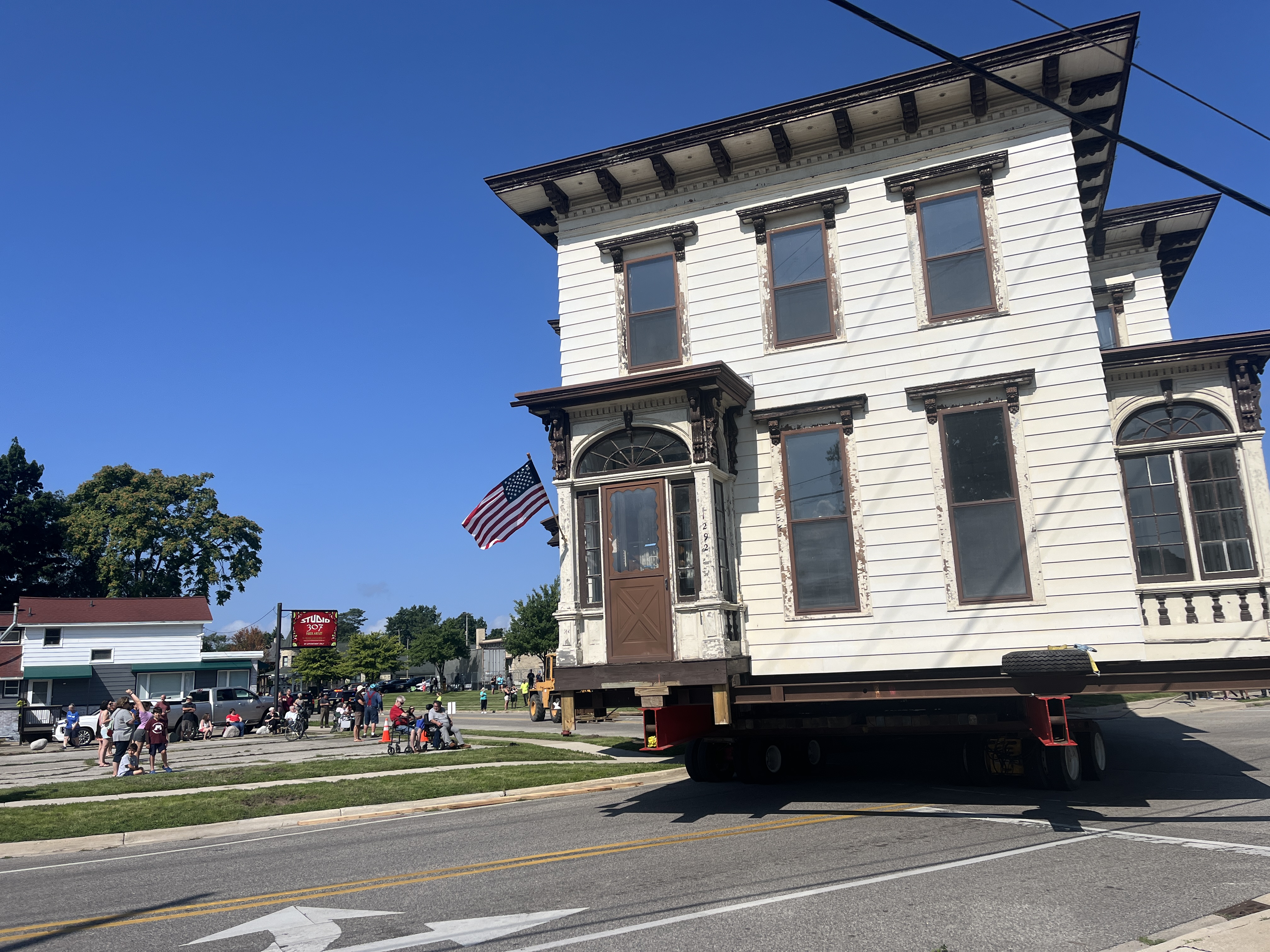 Historic mansion moves through downtown Muskegon
