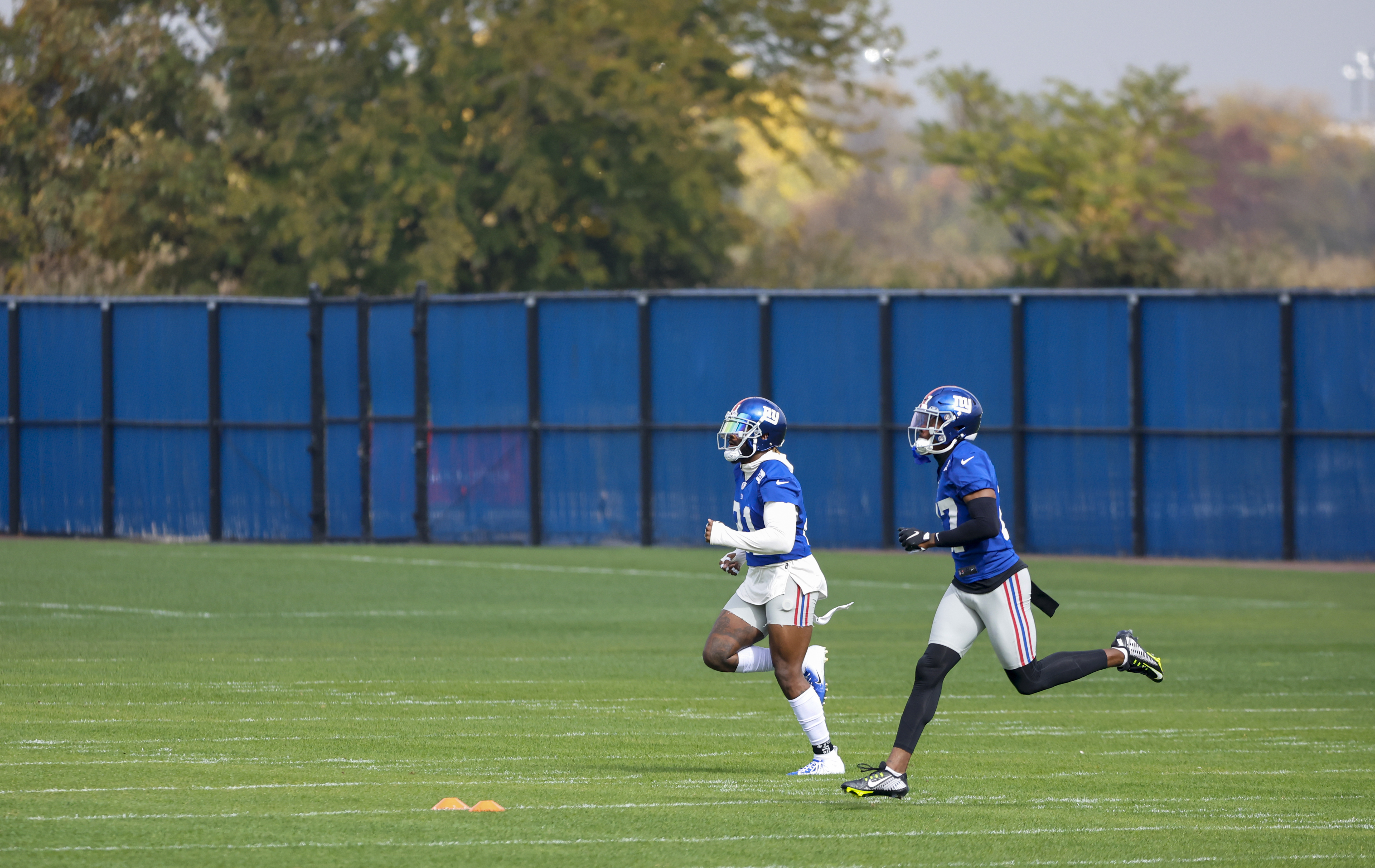New York Giants Landon Collins (21, left) and Jason Pinnock (27, right) run together during practice on Wednesday, Oct. 26, 2022. 