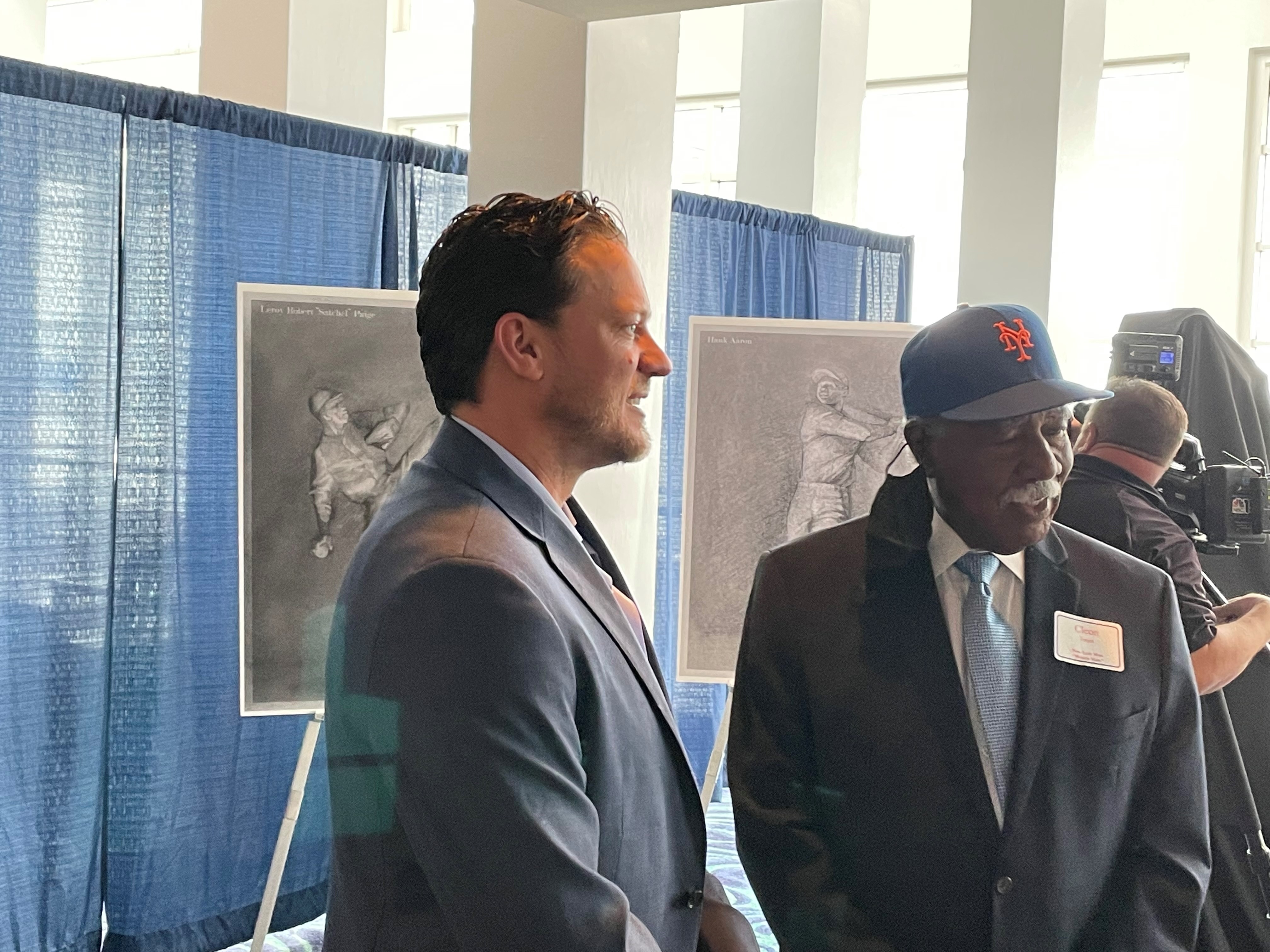 FILE - Hank Aaron and his wife, Billye, listen to Hall of Fame baseball  players speak at the dedication of the Hank Aaron Childhood Home and Museum  at Hank Aaron Stadium on