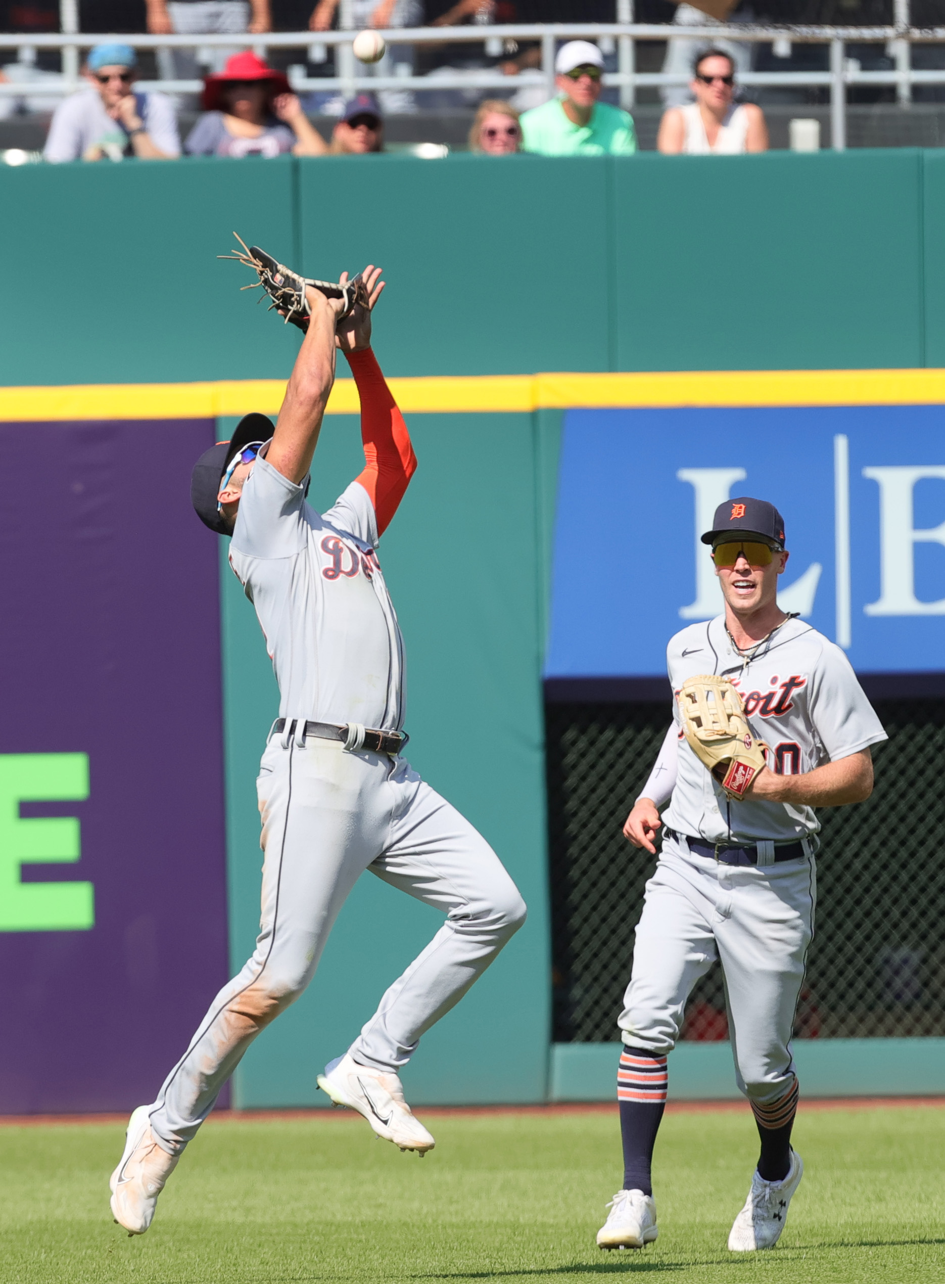 Detroit Tigers' Matt Vierling slides home after tagging on fly