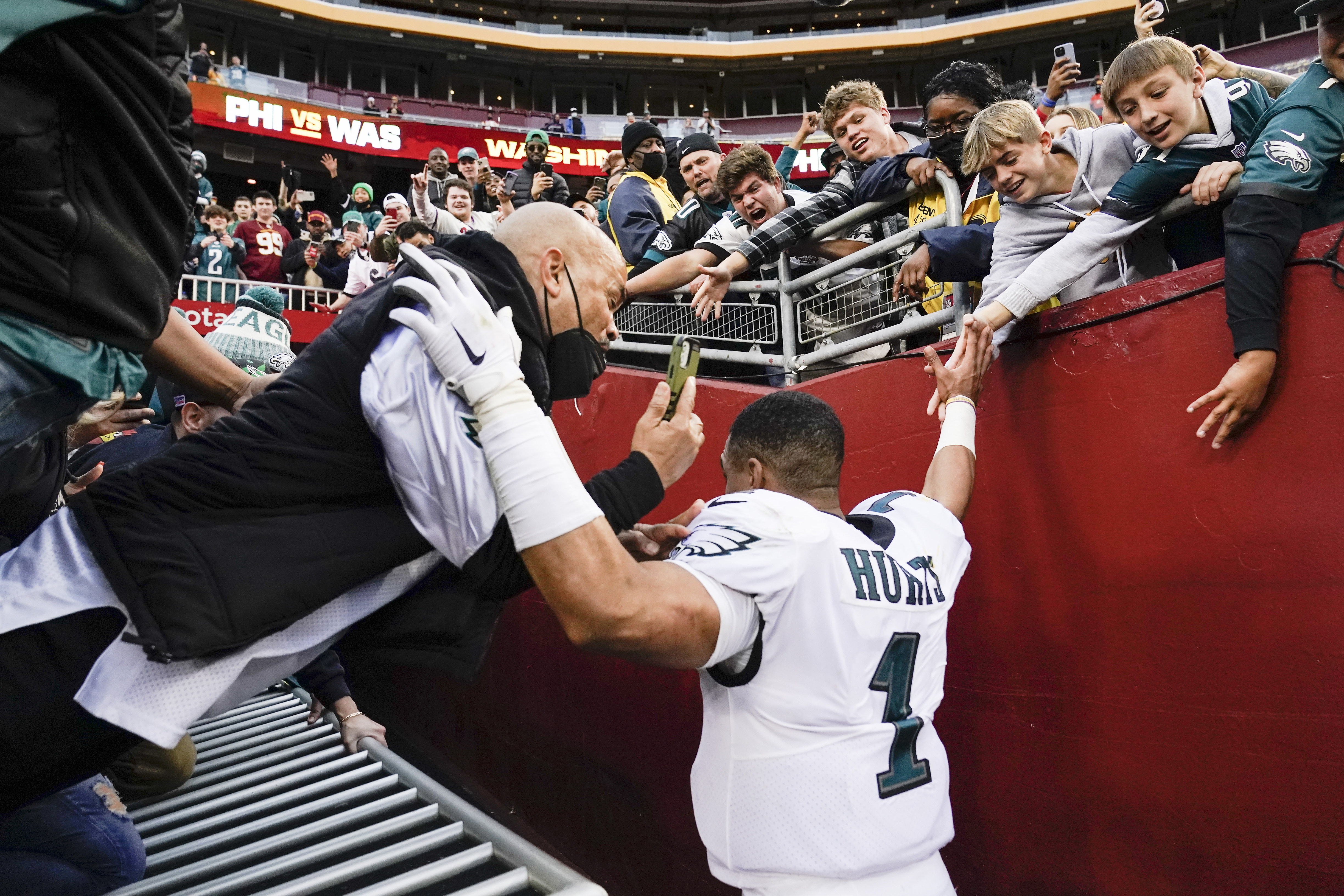 Eagles' Jalen Hurts avoids injury as railing collapses, fans fall