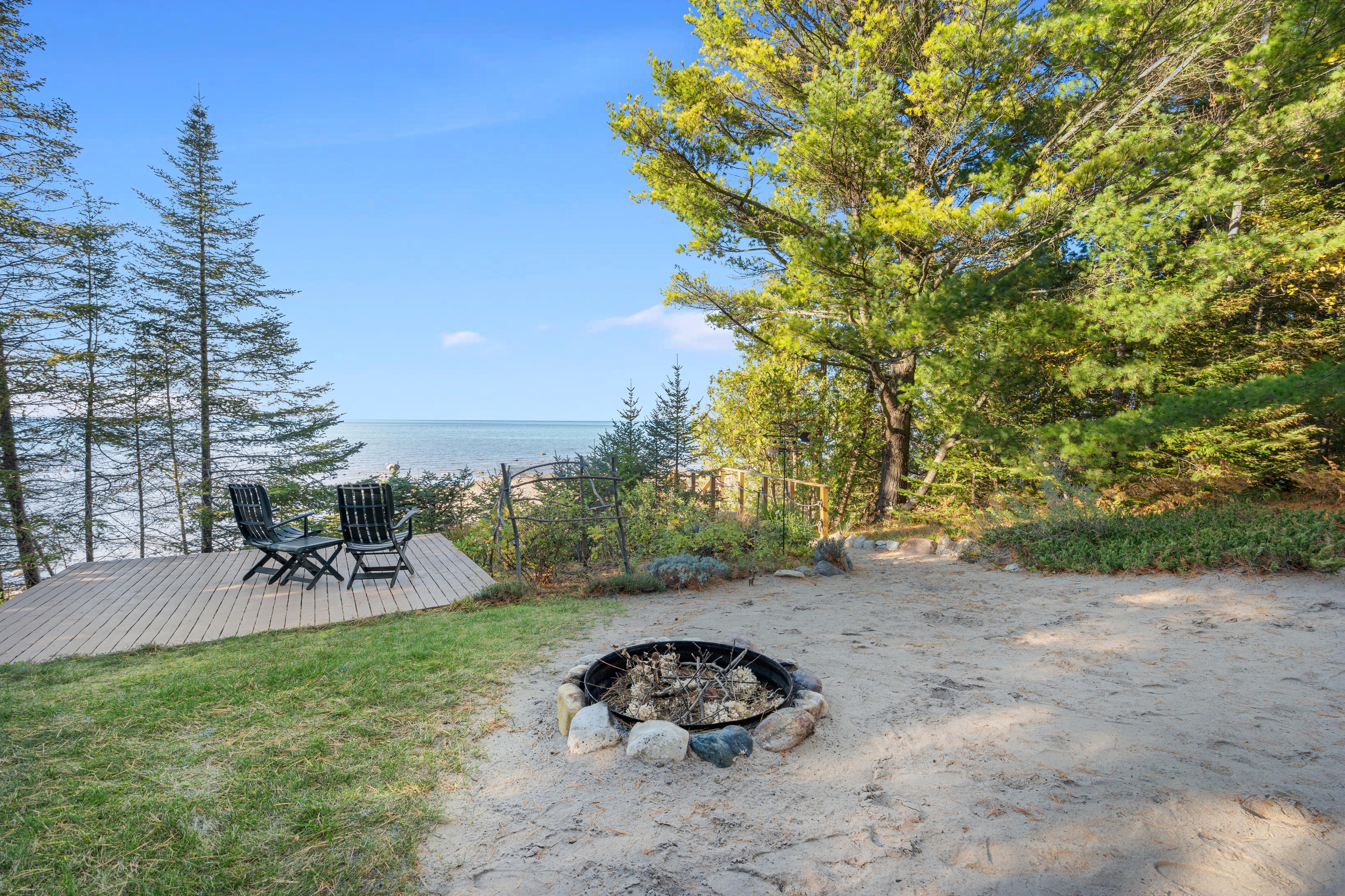 Exterior photographs of 4093 Lake Shore Drive in Charlevoix, this gem is listed at $2,099,900 through Berkshire Hathaway HomeServices Michigan Real Estate – Traverse City and The Crane Group with associate broker Johnny Crane and his brother, co-listing agent Matt Crane.