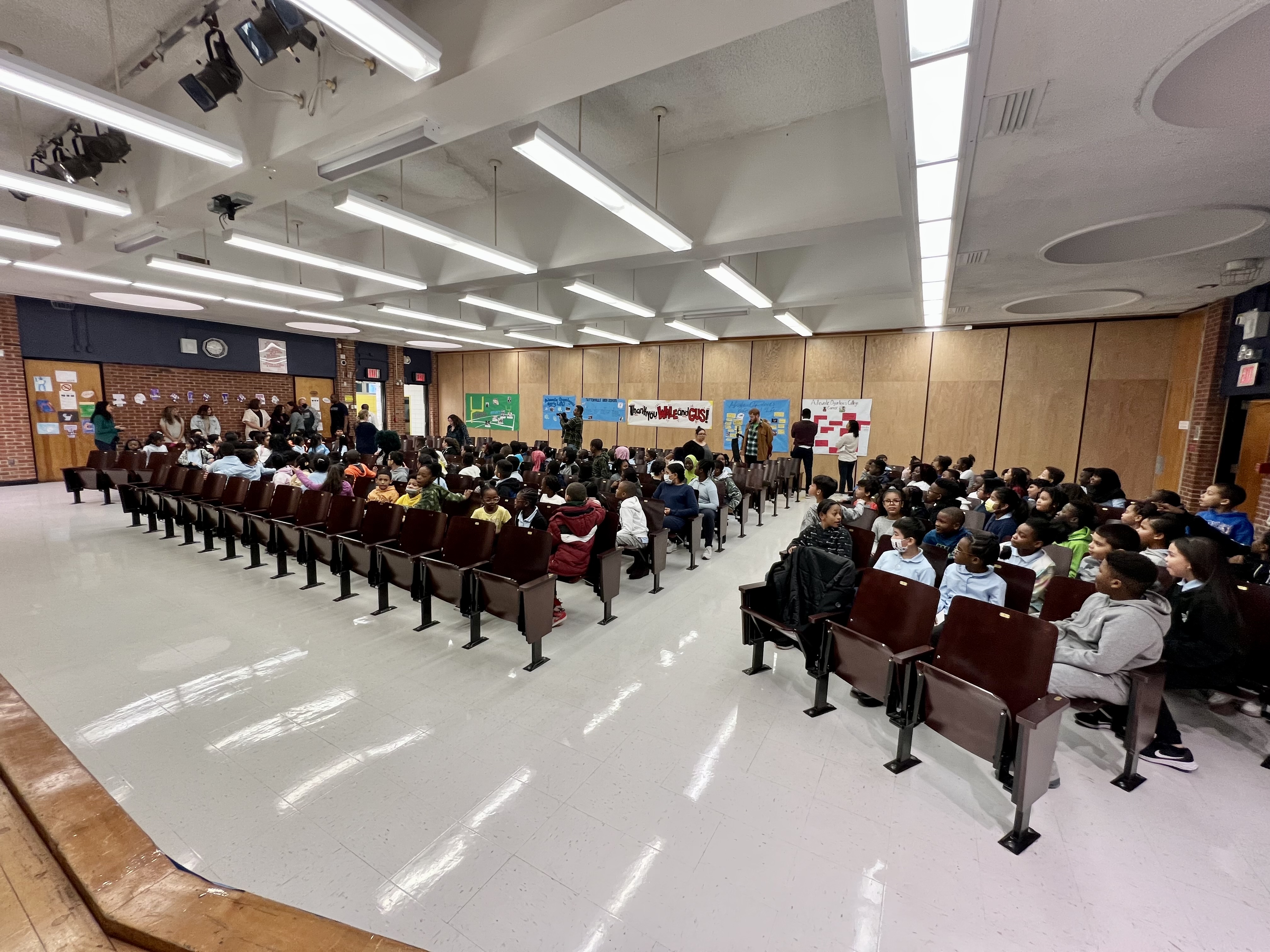 Local legend, former NFLer Adewale Ogunleye addresses kids, hands out gifts  at annual PS 57 giveaway (PHOTOS) 