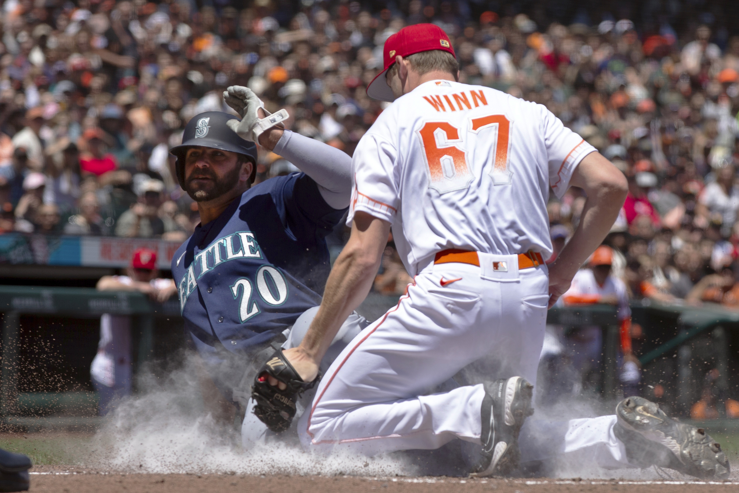 Seattle Mariners' AJ Pollock makes contact with the ball in a