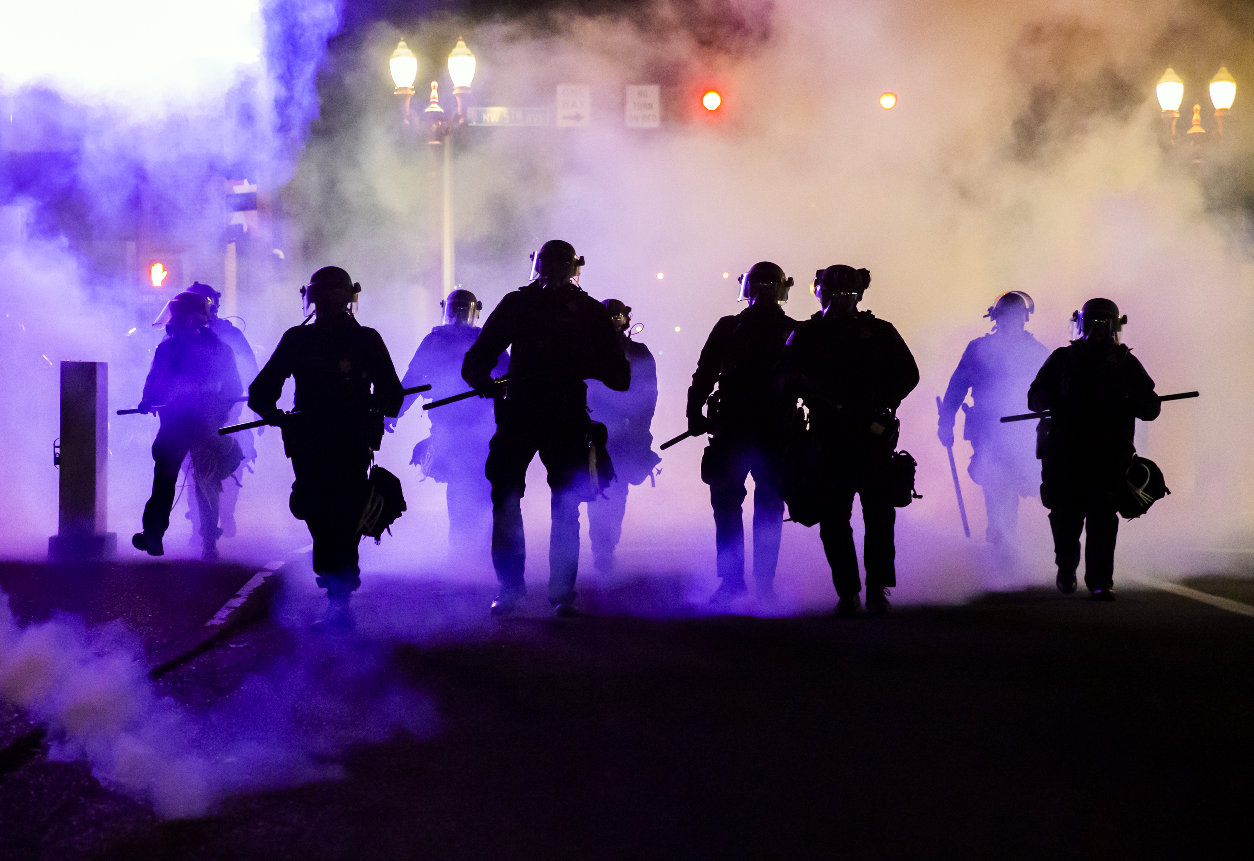 Police advance in a cloud of tear gas as Portlanders protest against the death of George Floyd, a black man killed by police in Minneapolis.  Dave Killen / Staff