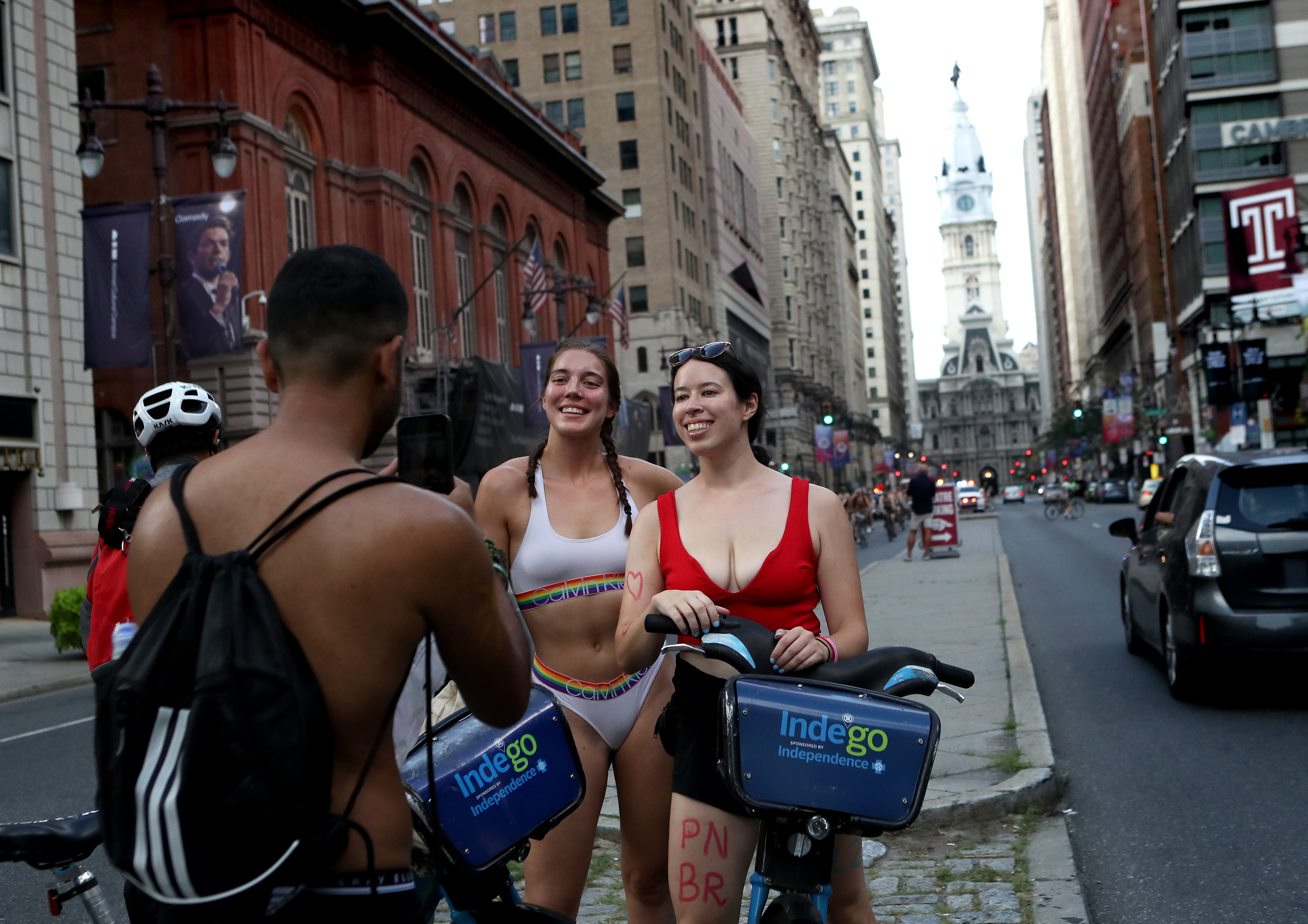 Philly Naked Bike Ride participants have their photo taken along South Broad Street in Philadelphia, Saturday, Aug. 27, 2022.