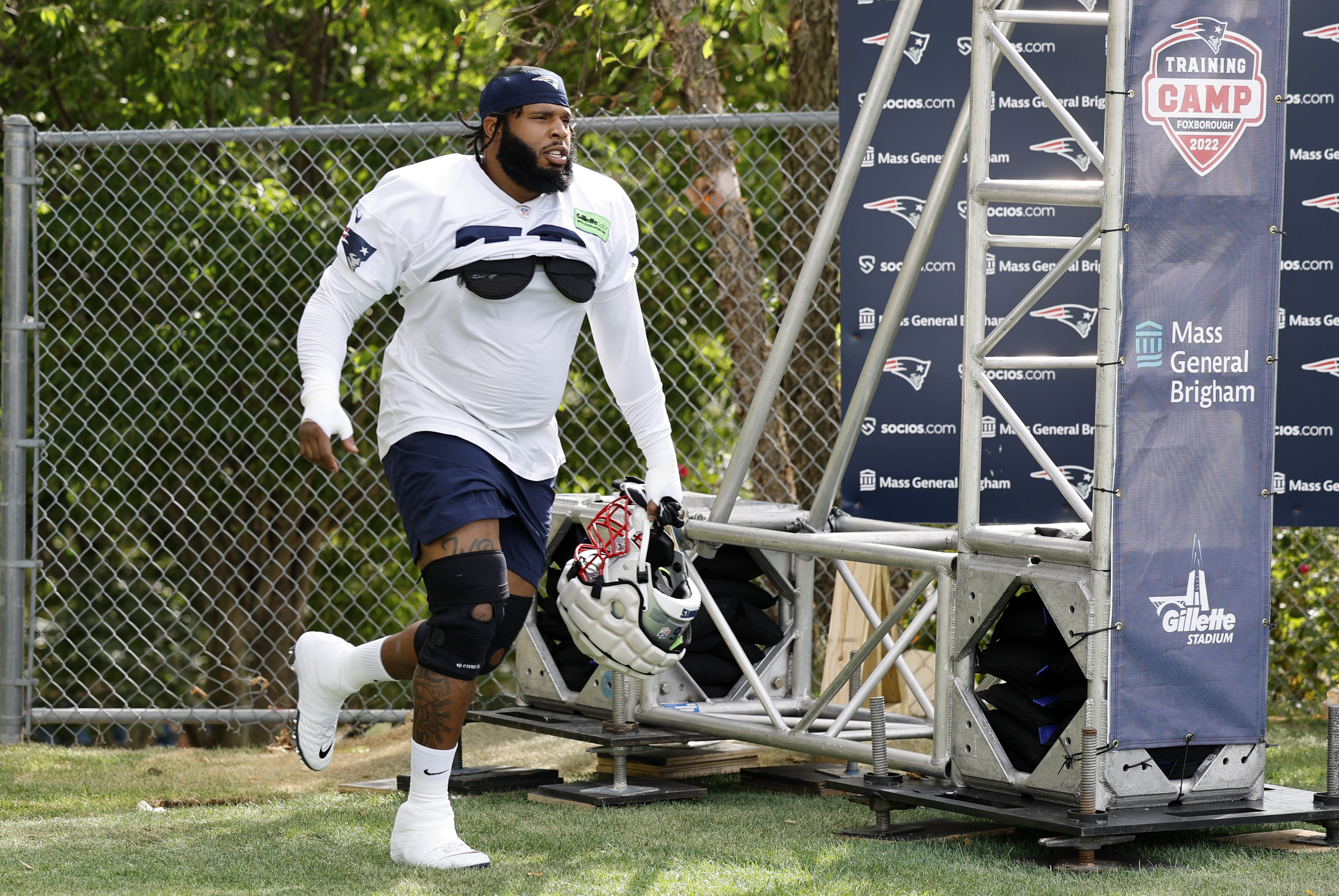 New England Patriots offensive tackle Isaiah Wynn (76) runs on the field  during the first half of an NFL football game against the Green Bay  Packers, Sunday, Oct. 2, 2022, in Green