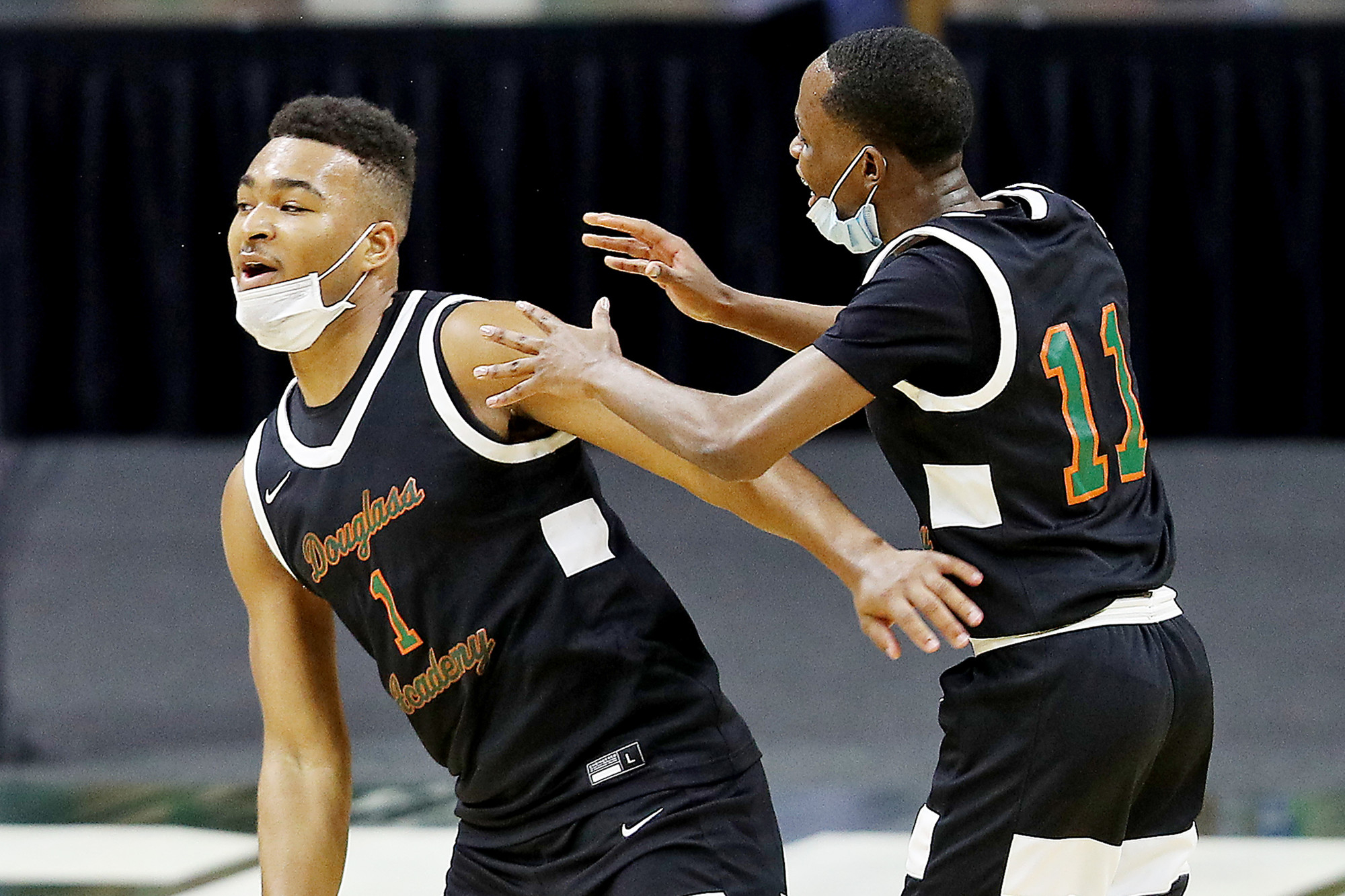Photos of Detroit Douglass basketball player Pierre Brooks II