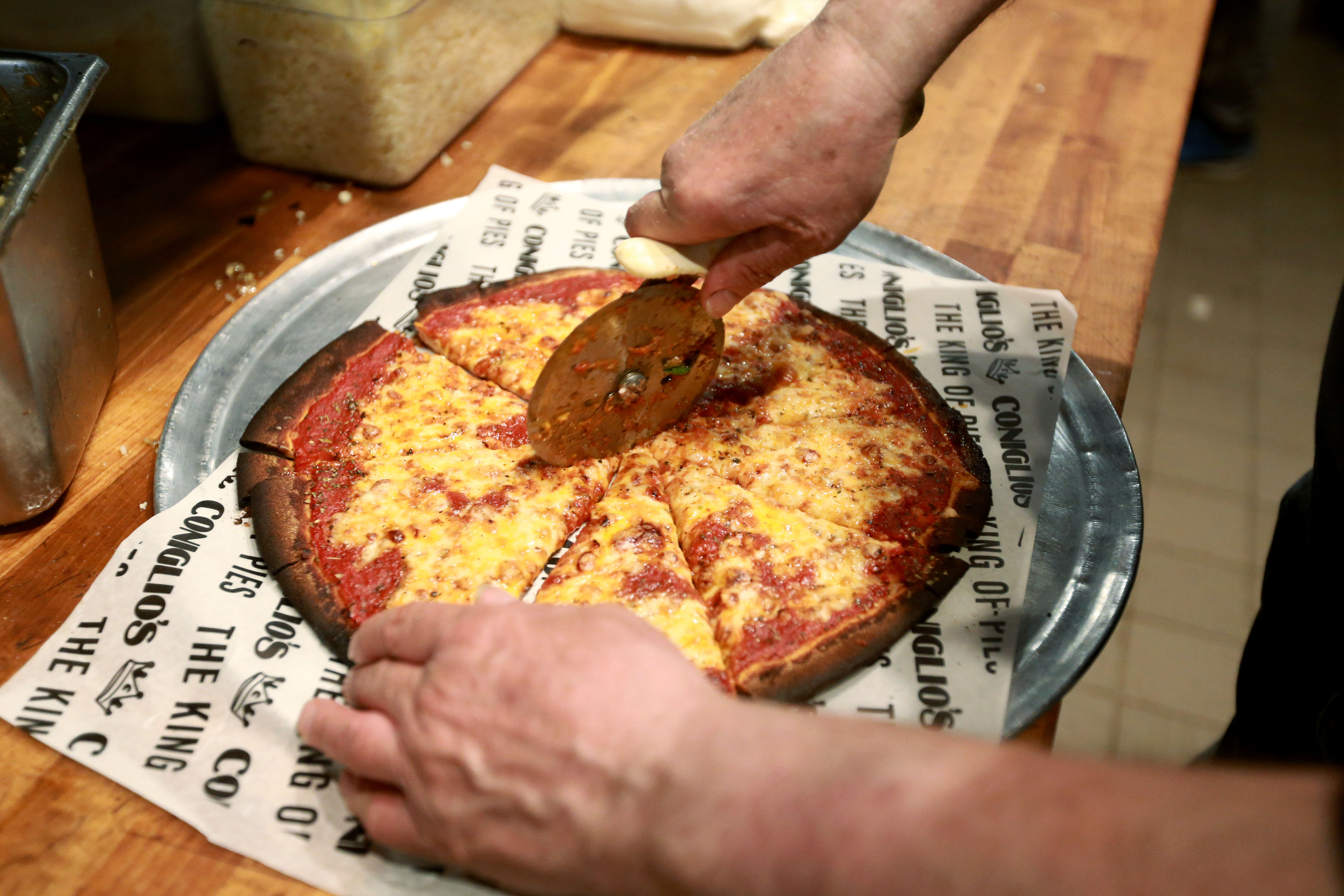 Pizza maker Al Santillo is making pizza at Coniglio’s as his place is ...