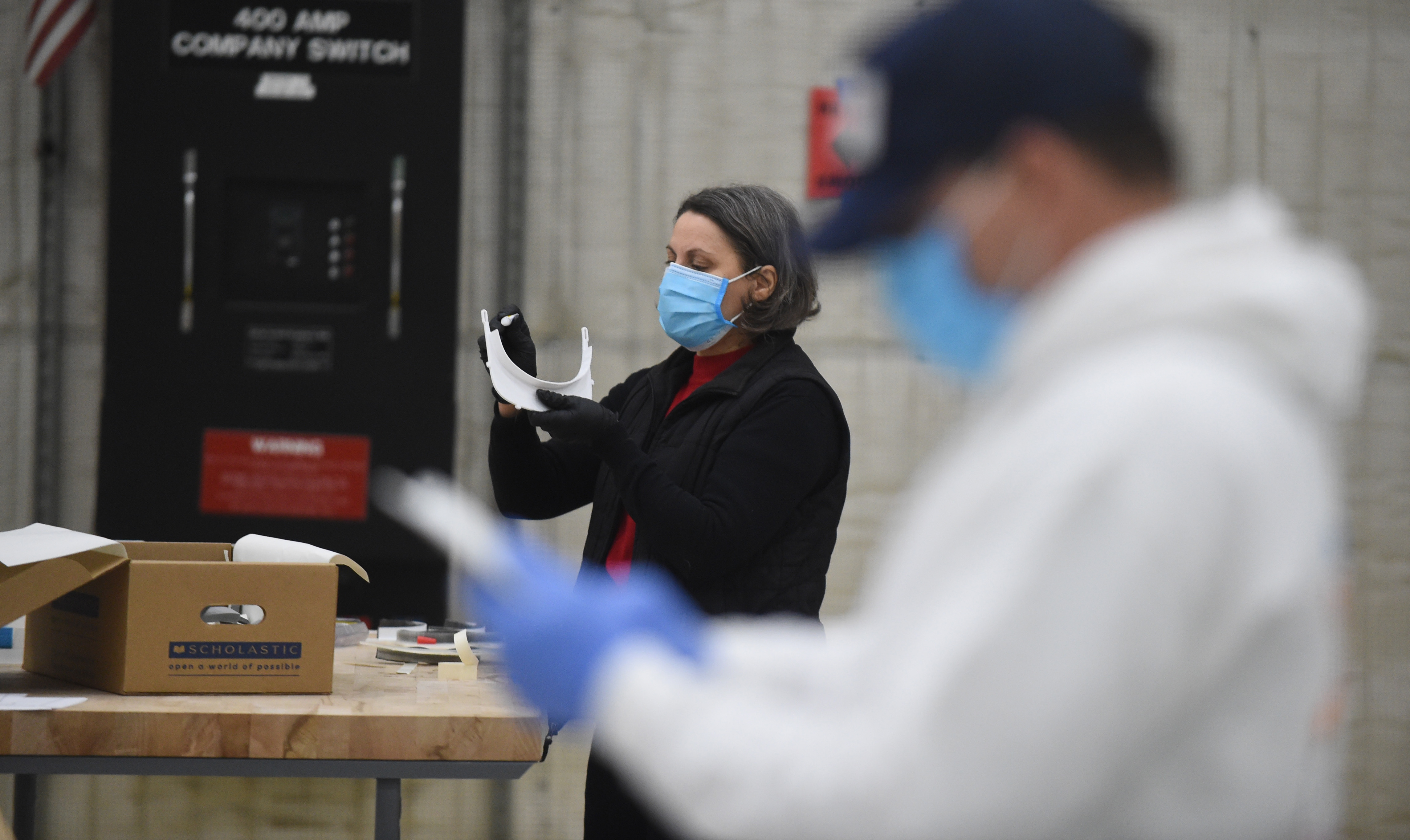 Volunteers step up to assemble face shields for coronavirus protection ...