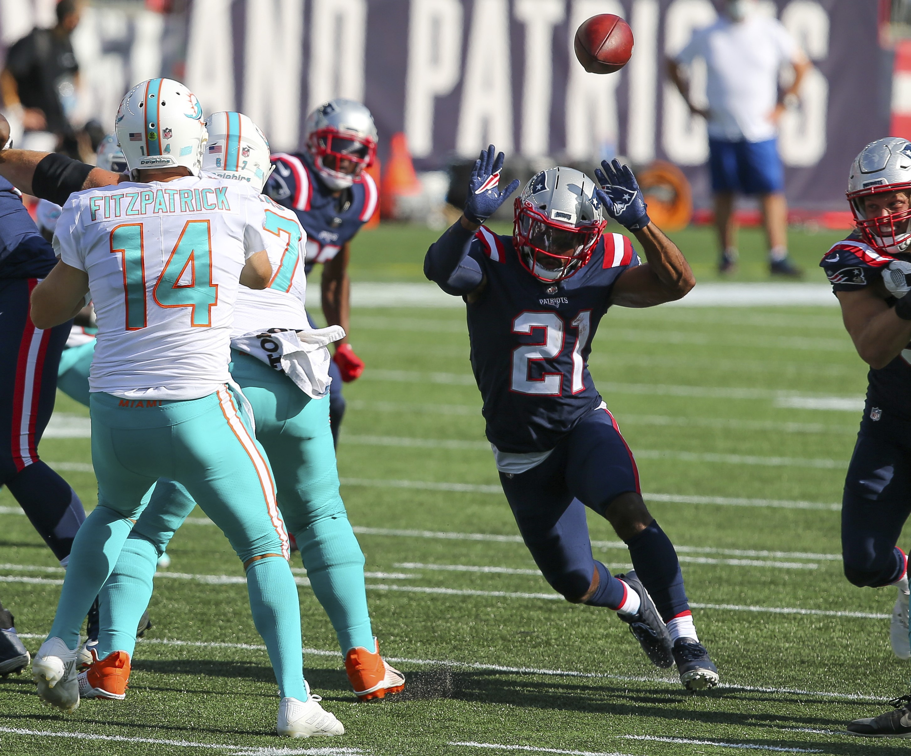 New England Patriots safety Adrian Phillips (21) defends against