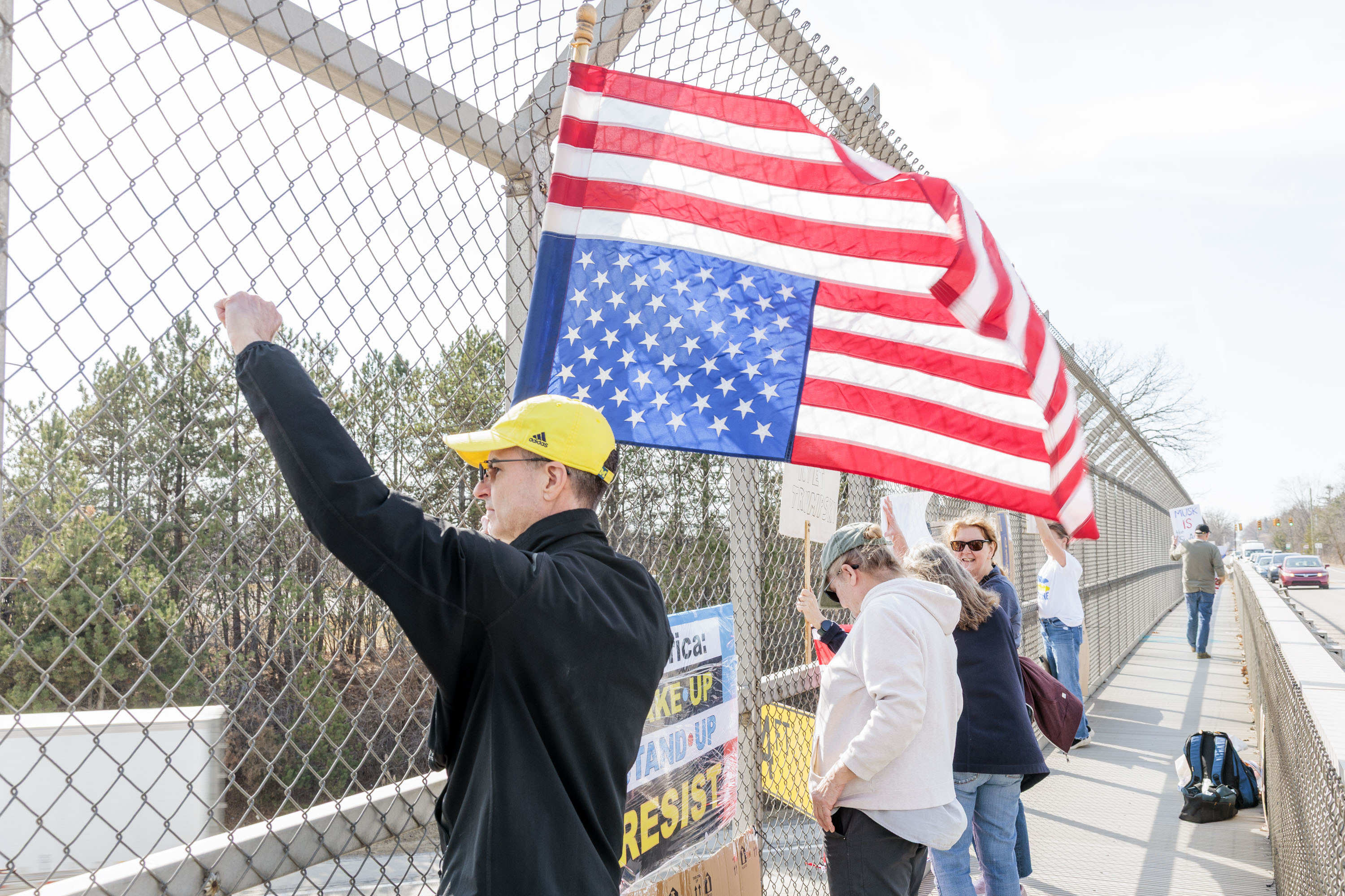 Demonstrators protest Trump Administration on four Ann Arbor pedestrian ...