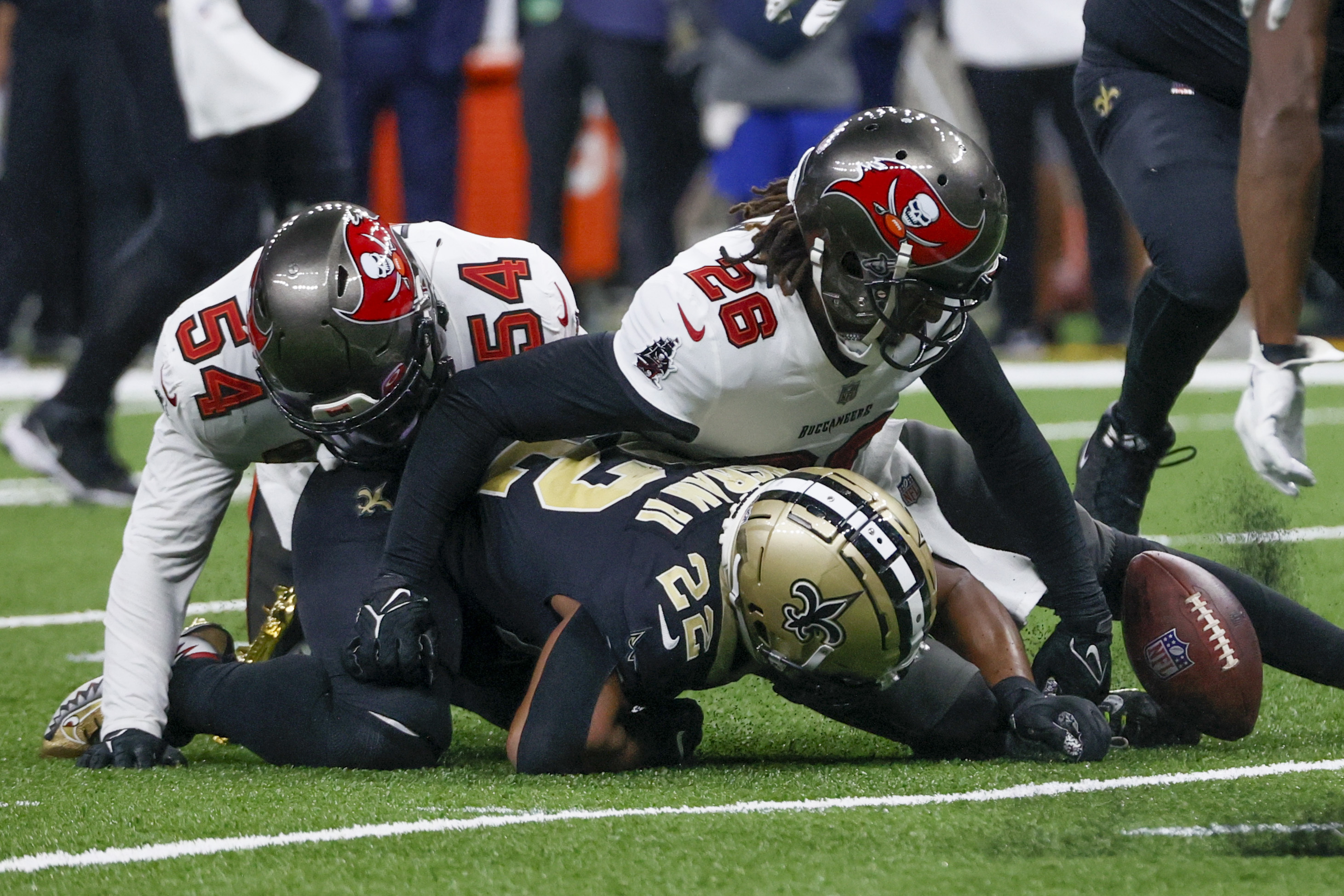 Kansas City Chiefs running back Isiah Pacheco (left) exchanges his